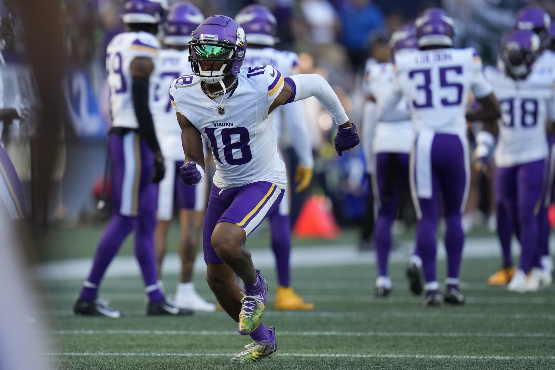 Minnesota Vikings wide receiver Justin Jefferson (18) warms up before an NFL preseason football game against the Seattle Seahawks in Seattle, Thursday, Aug. 10, 2023. (AP Photo/Gregory Bull)