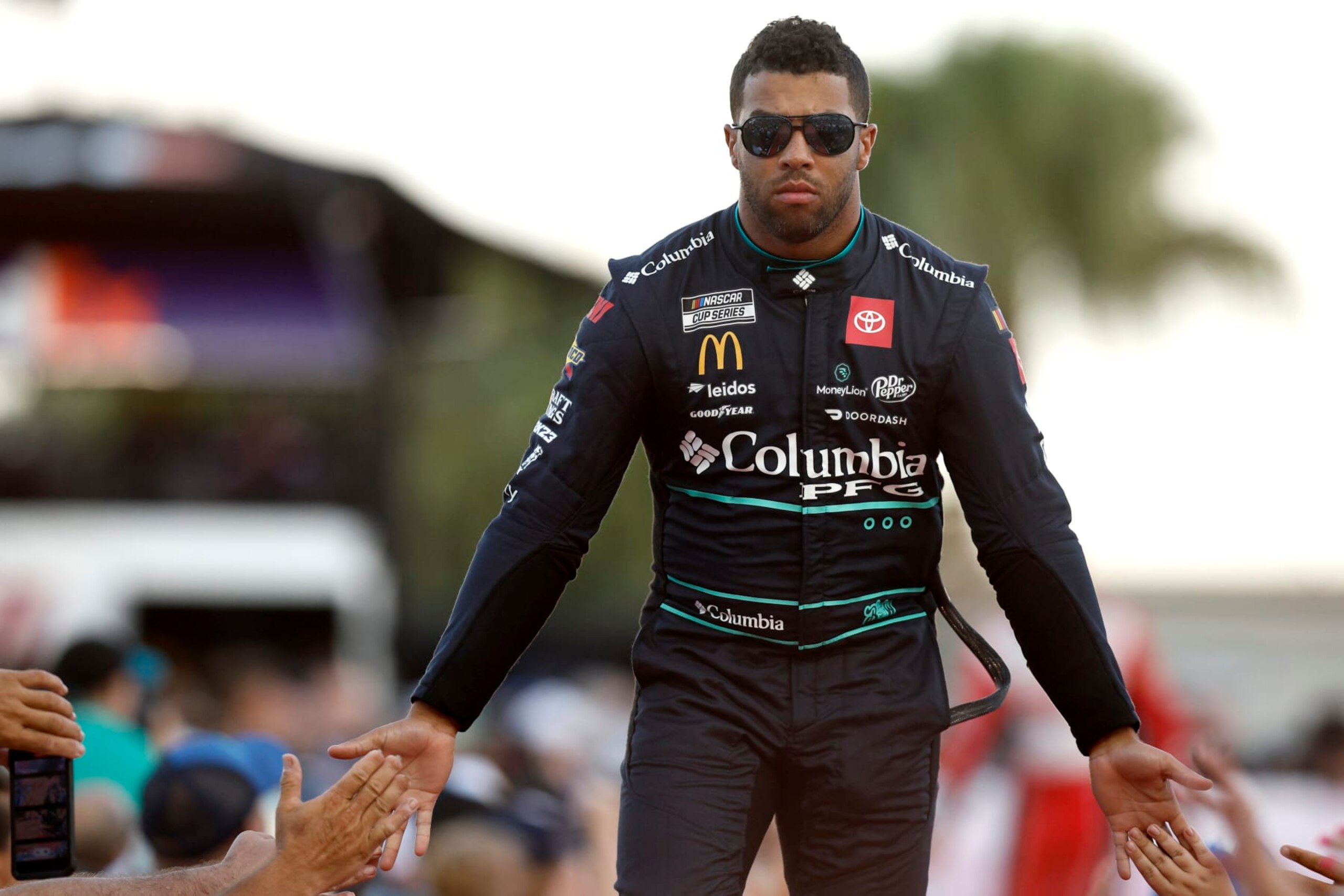 DAYTONA BEACH, FLORIDA - AUGUST 26: Bubba Wallace, driver of the #23 Columbia Sportswear Company Toyota, greets fans as he walks onstage during driver intros prior to the NASCAR Cup Series Coke Zero Sugar 400 at Daytona International Speedway on August 26, 2023 in Daytona Beach, Florida. (Photo by Sean Gardner/Getty Images)