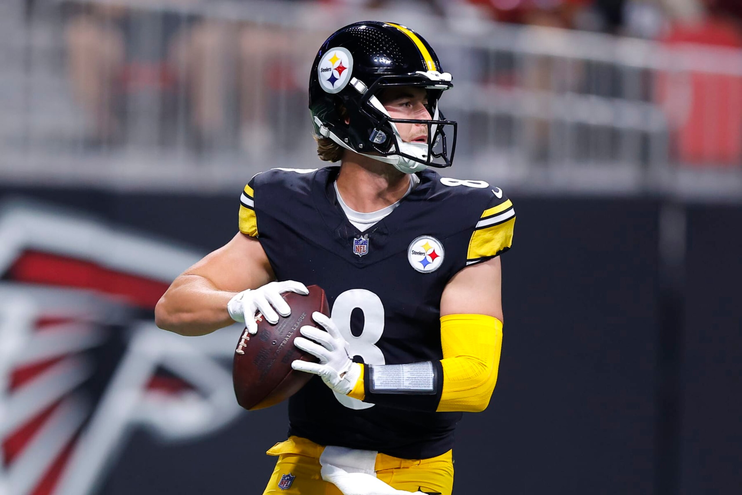 ATLANTA, GEORGIA - AUGUST 24: Kenny Pickett #8 of the Pittsburgh Steelers rolls out to pass during the first quarter of a preseason game against the Atlanta Falcons at Mercedes-Benz Stadium on August 24, 2023 in Atlanta, Georgia. (Photo by Todd Kirkland/Getty Images)