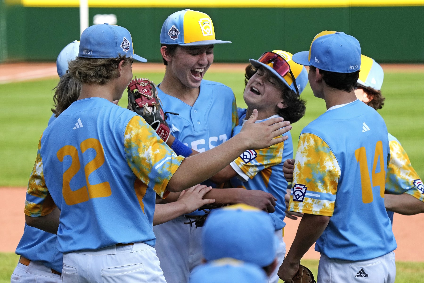 El Segundo, Calif.'s Louis Lappe, left center, and Max Baker, right center, celebrate with teammates after getting the final out in the United States Championship baseball game against Needville, Texas, at the Little League World Series tournament in South Williamsport, Pa., Saturday, Aug. 26, 2023. (AP Photo/Gene J. Puskar)