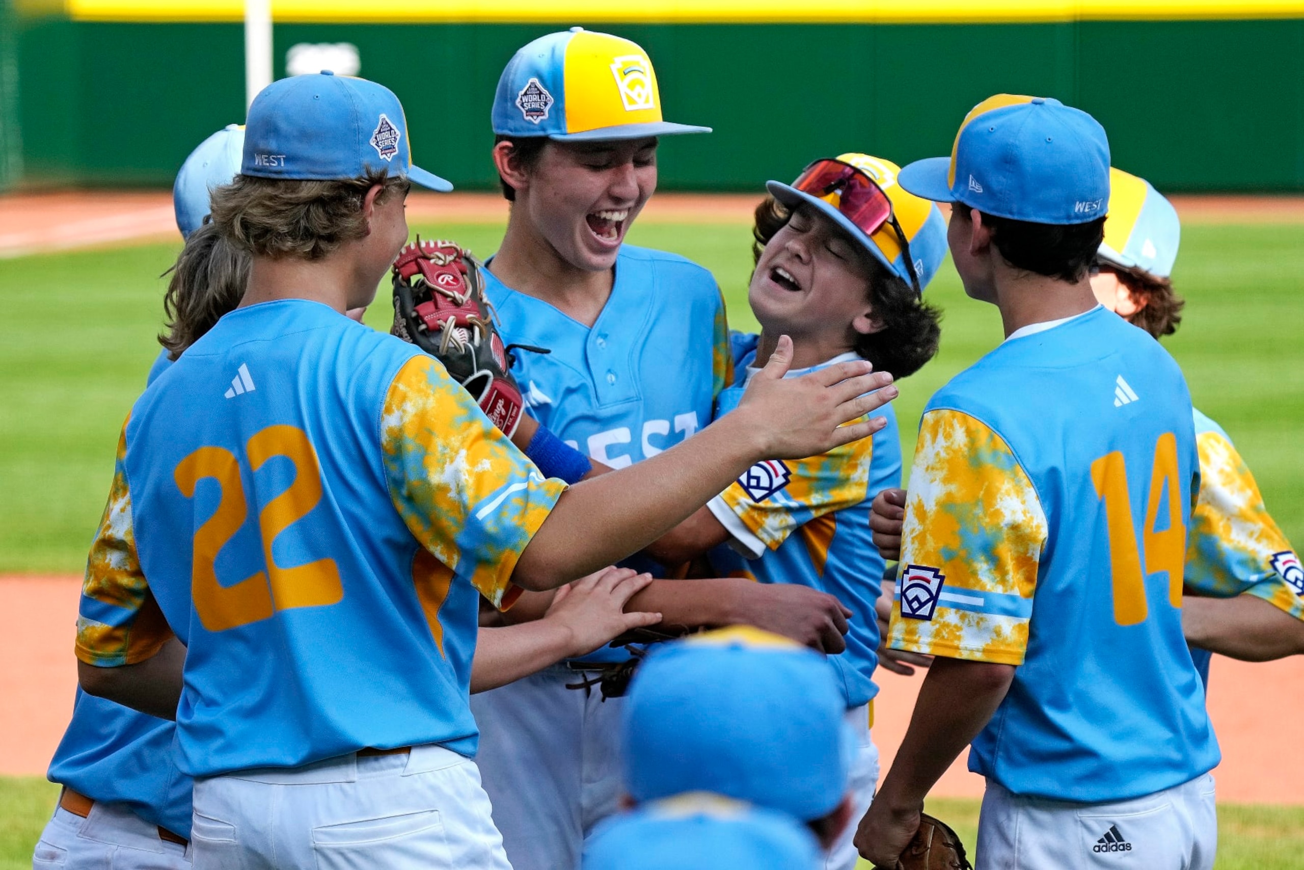 El Segundo, Calif.'s Louis Lappe, left center, and Max Baker, right center, celebrate with teammates after getting the final out in the United States Championship baseball game against Needville, Texas, at the Little League World Series tournament in South Williamsport, Pa., Saturday, Aug. 26, 2023. (AP Photo/Gene J. Puskar)