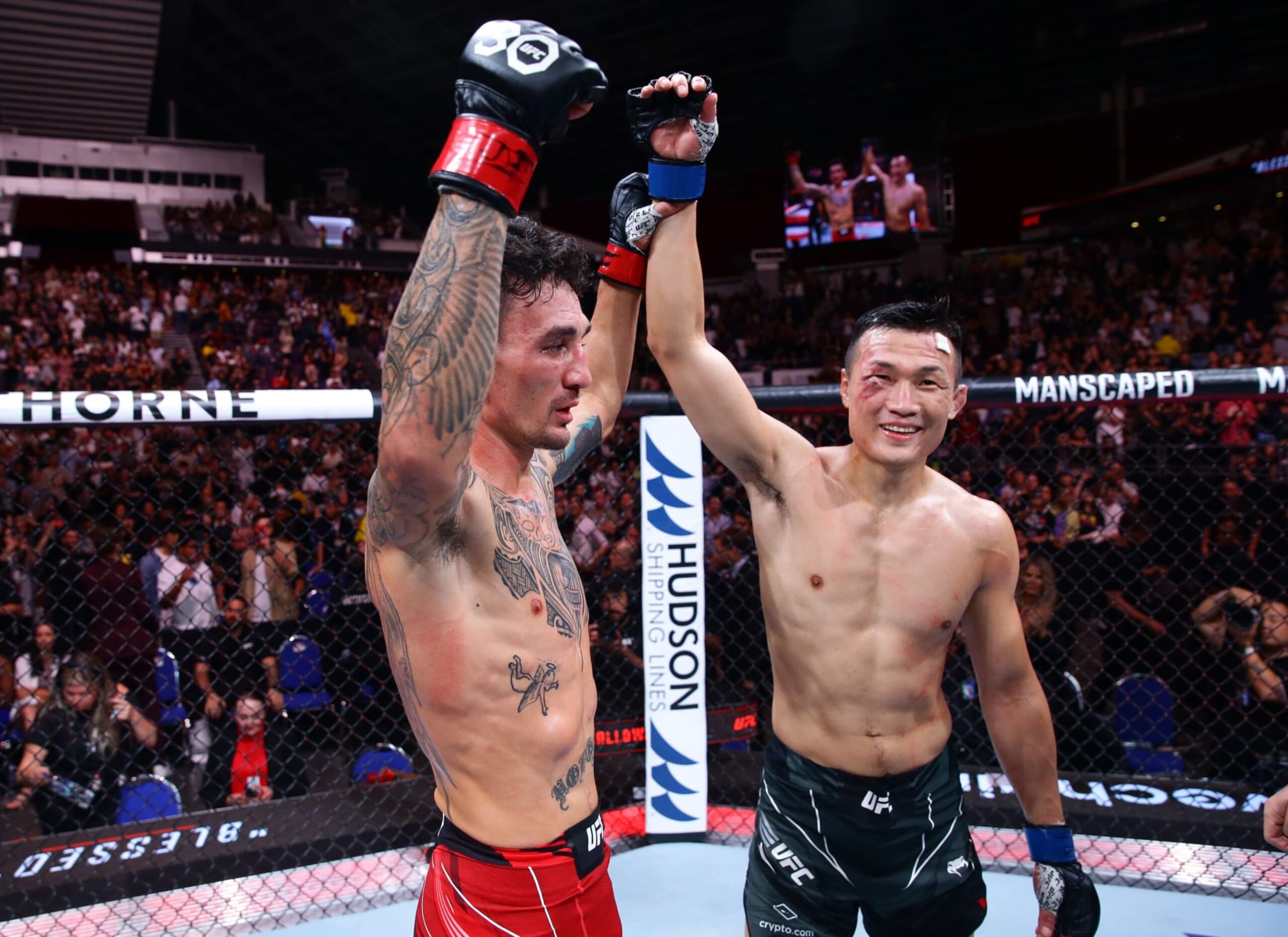 Max Holloway (left) and Chan Sung Jung