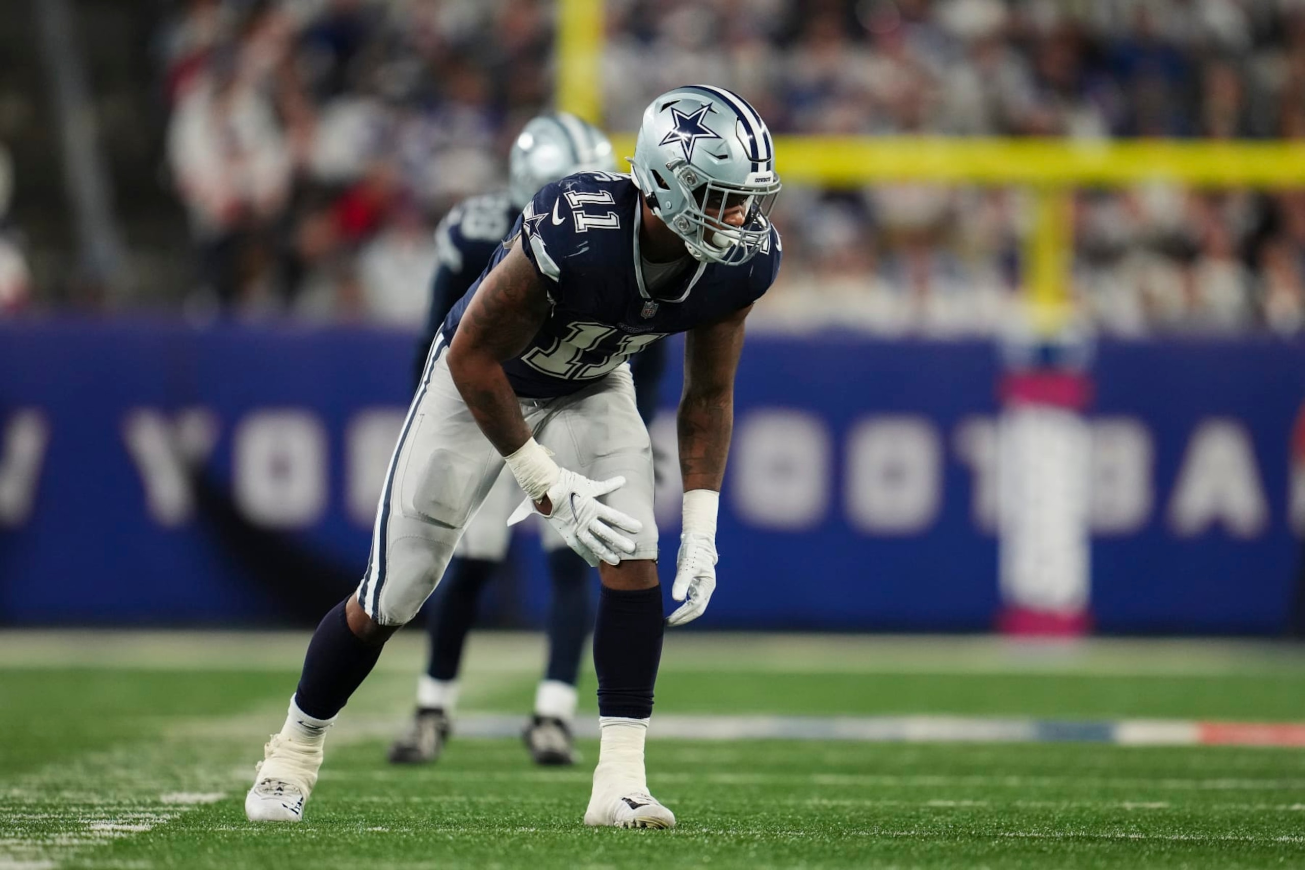 EAST RUTHERFORD, NJ - SEPTEMBER 26: Micah Parsons #11 of the Dallas Cowboys defends against the Dallas Cowboys at MetLife Stadium on September 26, 2022 in East Rutherford, New Jersey. (Photo by Cooper Neill/Getty Images)