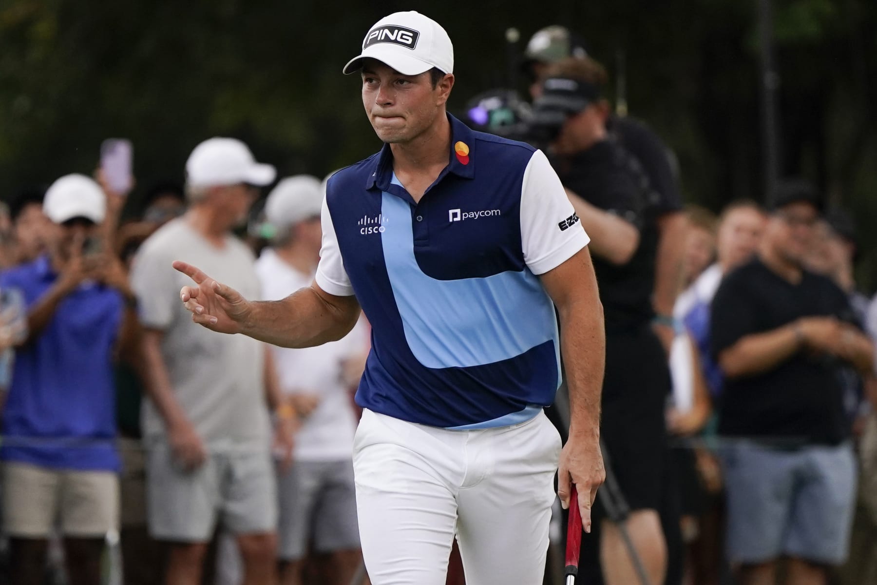 Viktor Hovland, of Norway, reacts to his putt on the first green during the third round of the Tour Championship golf tournament, Sunday, Aug. 27, 2023, in Atlanta. (AP Photo/Mike Stewart)