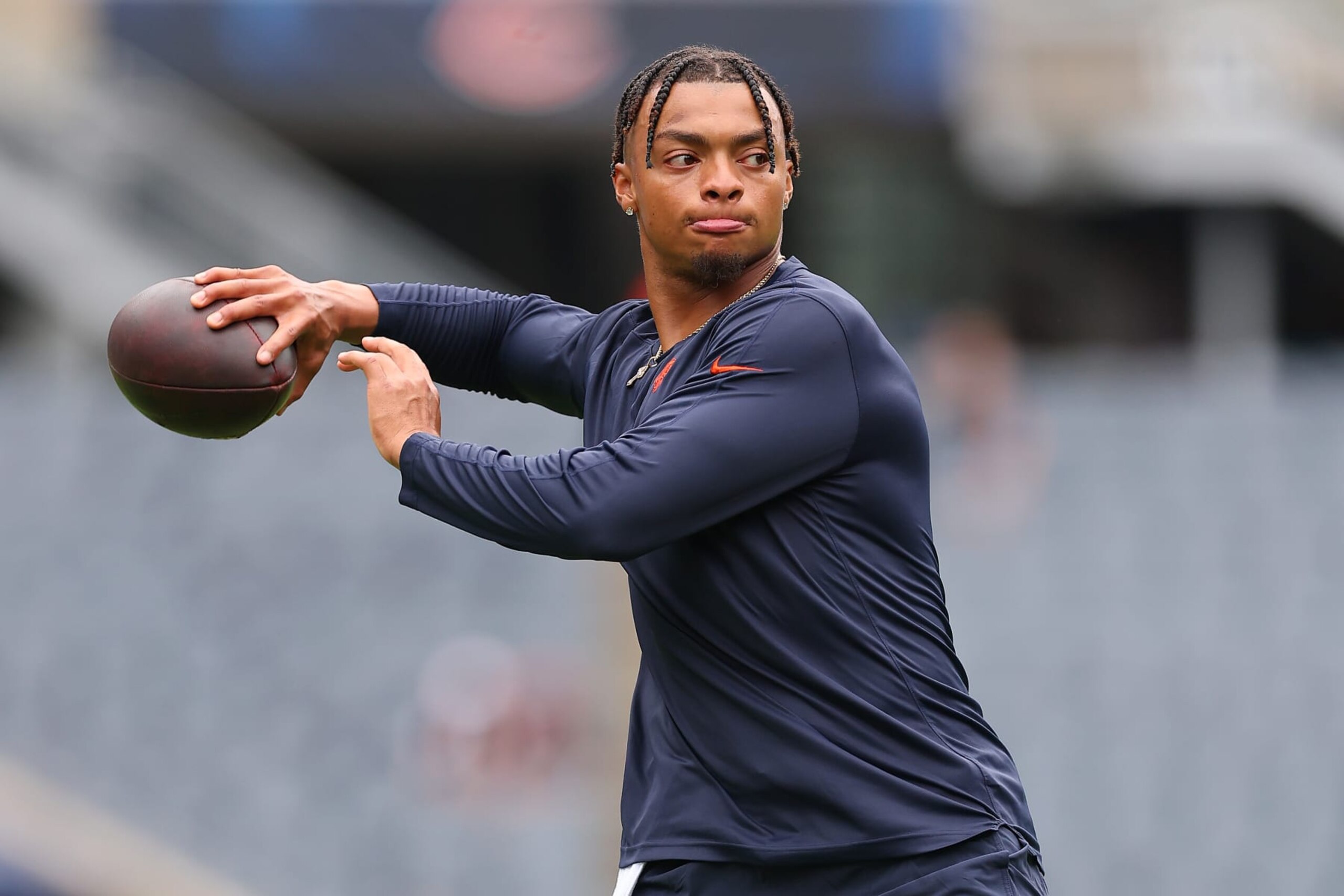 CHICAGO, ILLINOIS - AUGUST 26: Justin Fields #1 of the Chicago Bears warms up prior to a preseason game against the Buffalo Bills at Soldier Field on August 26, 2023 in Chicago, Illinois. (Photo by Michael Reaves/Getty Images)