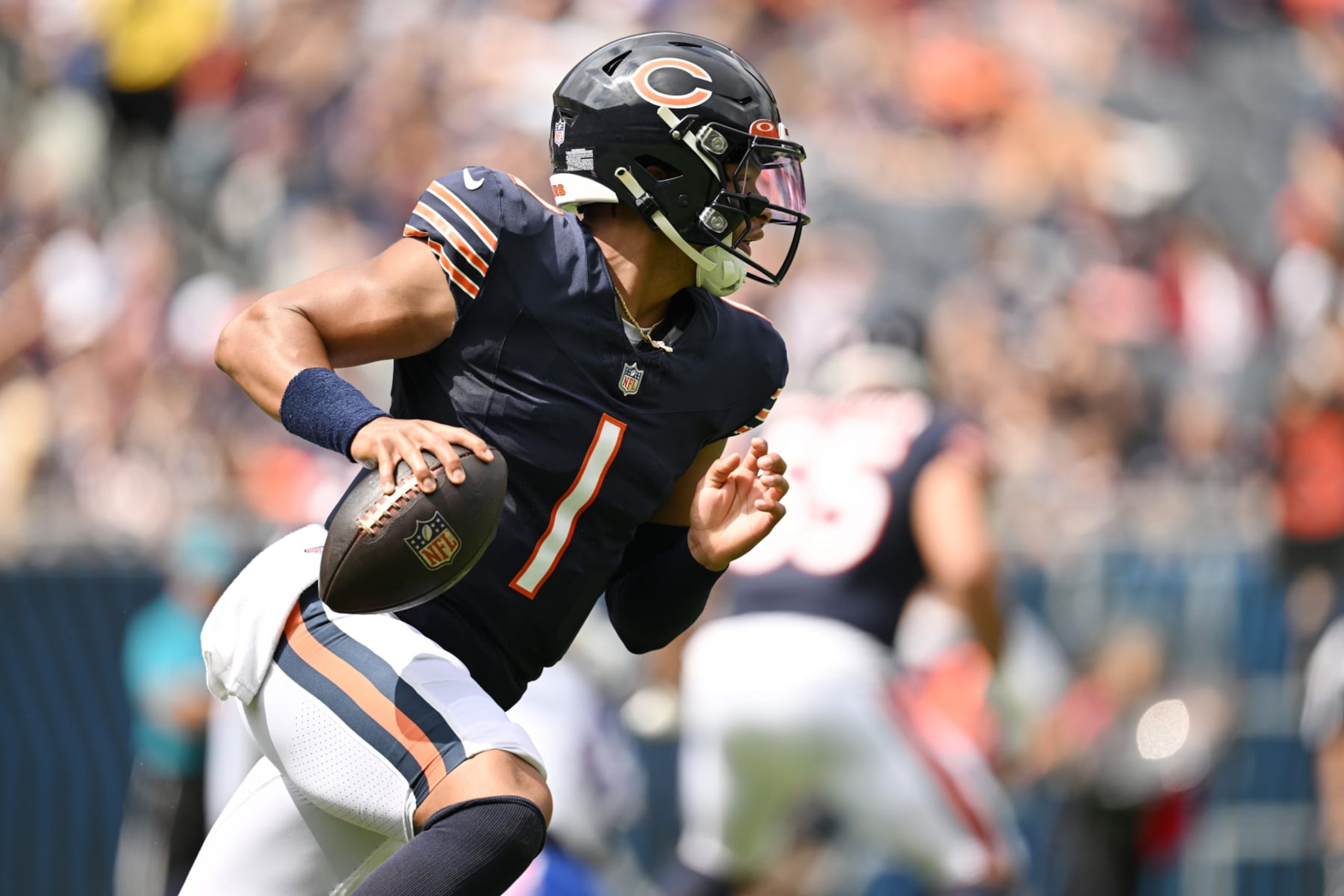 CHICAGO, ILLINOIS - AUGUST 26: Justin Fields #1 of the Chicago Bears looks to pass the ball in the first of a preseason game against the Buffalo Bills at Soldier Field on August 26, 2023 in Chicago, Illinois. (Photo by Quinn Harris/Getty Images)