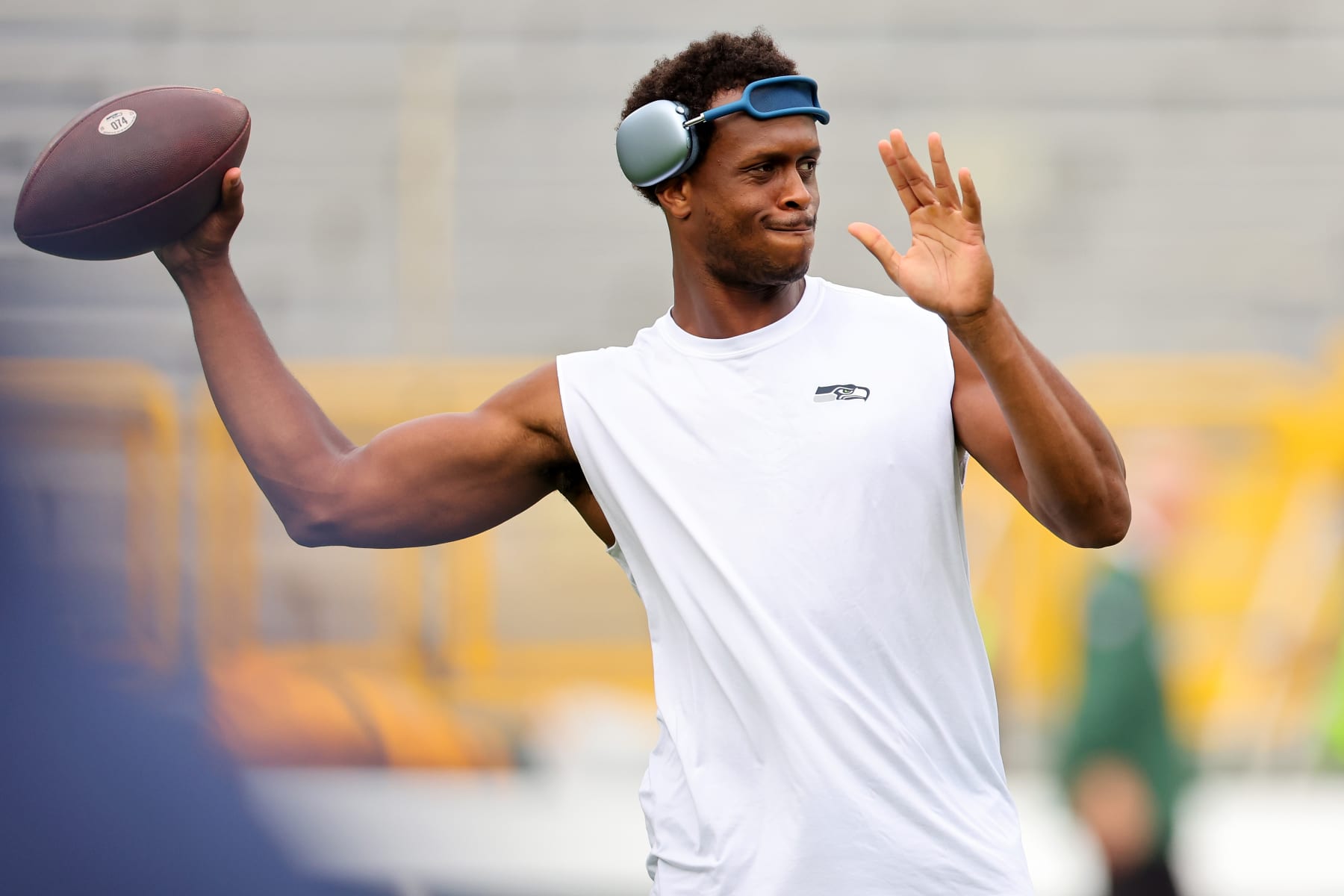 GREEN BAY, WISCONSIN - AUGUST 26: Geno Smith #7 of the Seattle Seahawks participates in warmups prior to a preseason game against the Green Bay Packers at Lambeau Field on August 26, 2023 in Green Bay, Wisconsin. (Photo by Stacy Revere/Getty Images)