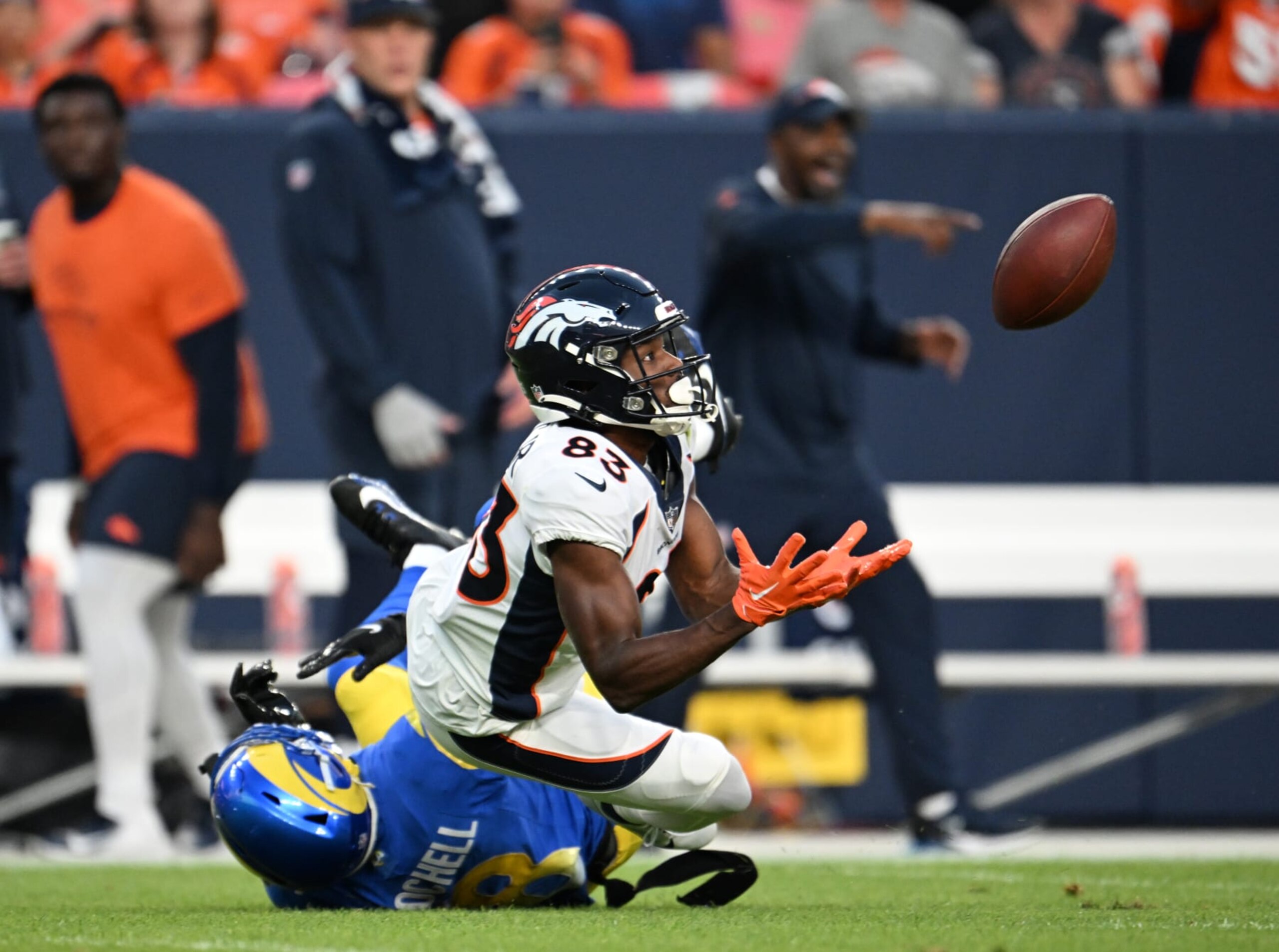 DENVER, COLORADO - AUGUST 26: Denver Broncos wide receiver Marvin Mims Jr. (83) dives to catch a 50-plus-yard pass from Denver Broncos quarterback Jarrett Stidham (4) during the first quarter at Empower Field on August 26, 2023 in Denver, Colorado. The Denver Broncos took on the Los Angeles Rams during their third and final preseason game of the 2023 NFL season. (Photo by RJ Sangosti/MediaNews Group/The Denver Post via Getty Images)