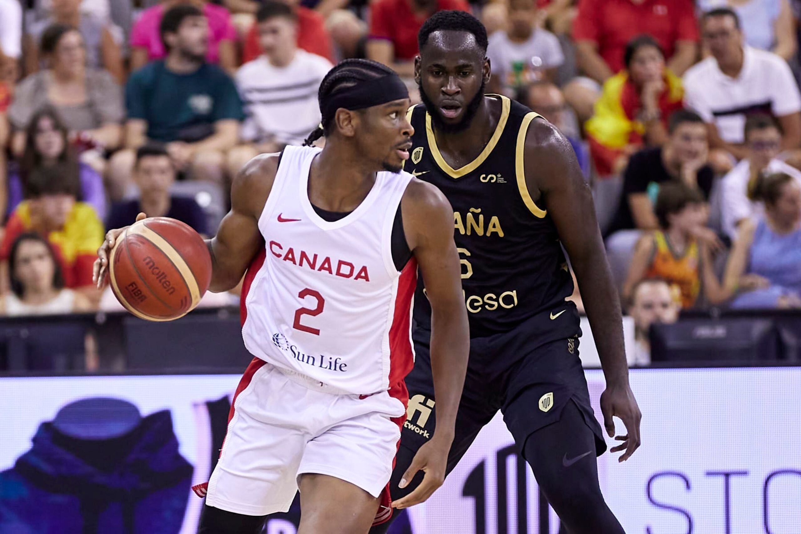 GRANADA, SPAIN - AUGUST 17: Shai Gilgeous-Alexander of the Canada Men's National Basketball Team competes for the ball with Usman Garuba of the Spain Men's National Basketball Team during the Ciudad de Granada Trophy match between Spain and Canada at Palacio Municipal de Deportes de Granada on August 17, 2023 in Granada, Spain. (Photo by Fermin Rodriguez/Quality Sport Images/Getty Images) GRANADA, SPAIN - AUGUST 17: Shai Gilgeous-Alexander of the Canada Men's National Basketball Team competes for the ball with Usman Garuba of the Spain Men's National Basketball Team during the Ciudad de Granada Trophy match between Spain and Canada at Palacio Municipal de Deportes de Granada on August 17, 2023 in Granada, Spain. (Photo by Fermin Rodriguez/Quality Sport Images/Getty Images)