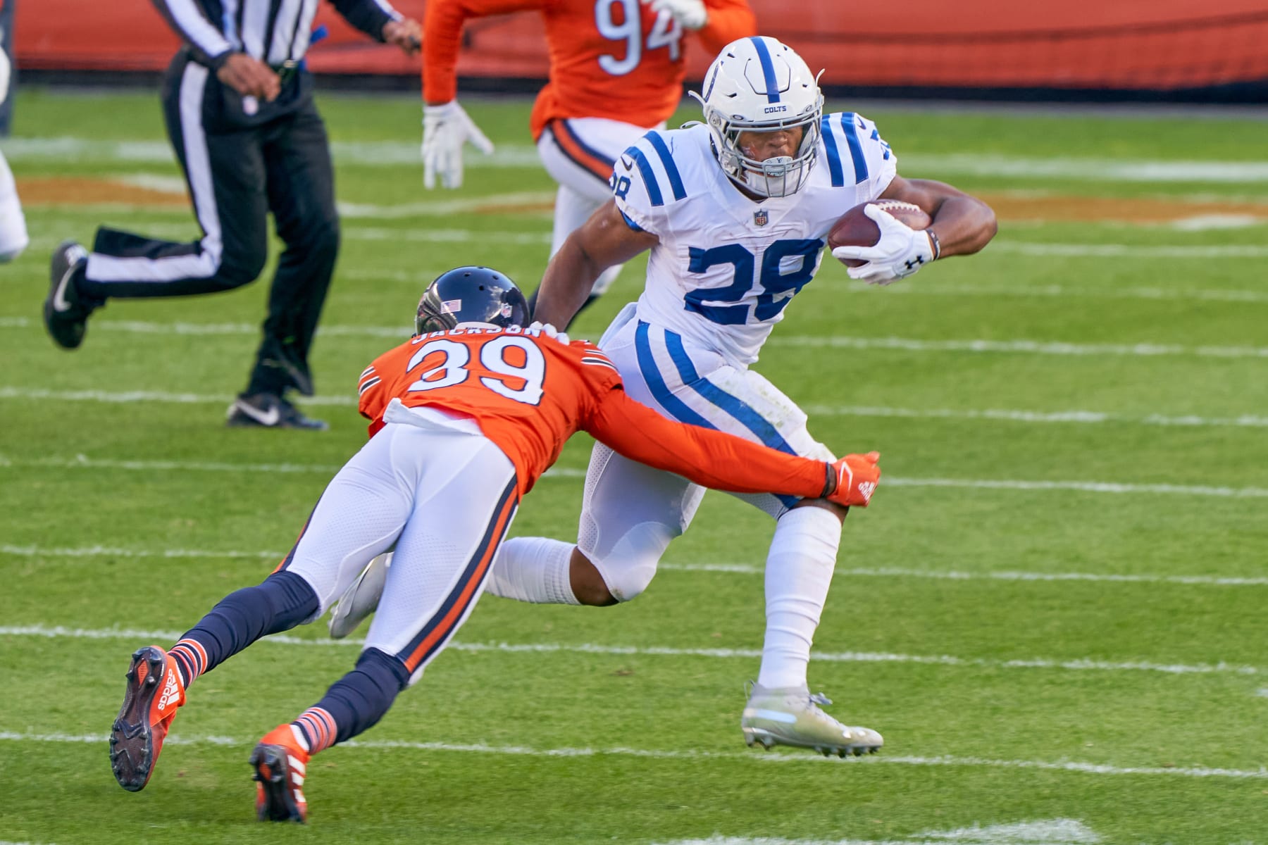 CHICAGO, IL - OCTOBER 04: Indianapolis Colts Running Back Jonathan Taylor (28) Chicago Bears Safety Eddie Jackson (39) in game action during a NFL game between the Chicago Bears and the Indianapolis Colts on October 4th, 2020, at Soldier Field in Chicago, IL.  (Photo by Robin Alam/Icon Sportswire via Getty Images)
