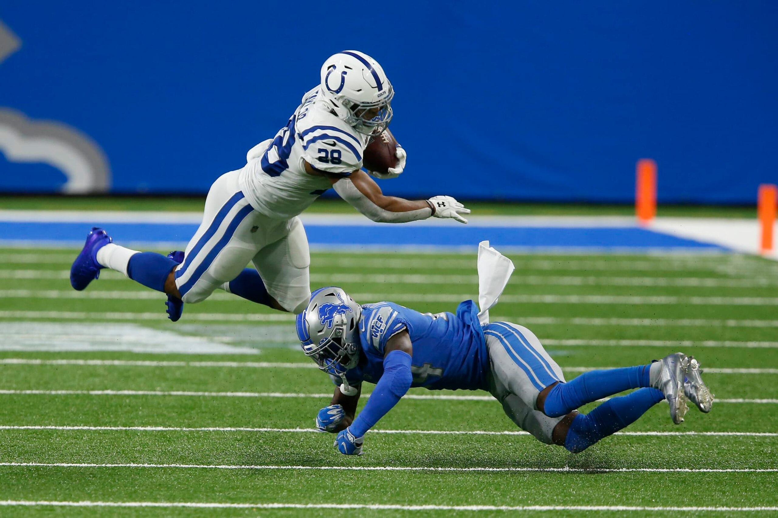 DETROIT, MI - NOVEMBER 01: Indianapolis Colts Running Back Jonathan Taylor (28) is up ended by Detroit Lions Cornerback Amani Oruwariye (24) in game action during a NFL game between the Indianapolis Colts and the Detroit Lions on November 01, 2020 at Ford Field in Detroit MI. (Photo by Jeffrey Brown/Icon Sportswire via Getty Images)