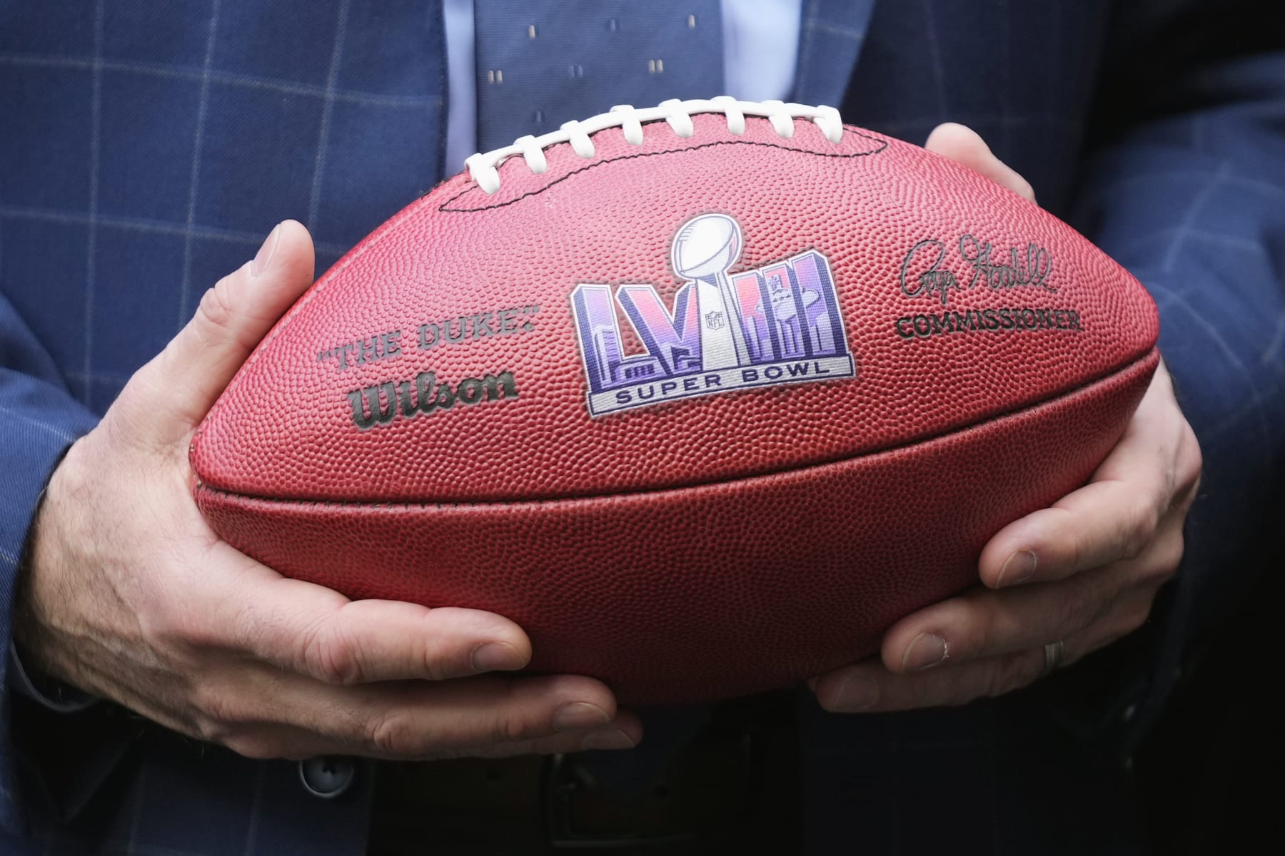 Nevada Republican Gov. Joe Lombardo holds an NFL football with the Super Bowl LVIII logo on it after the Arizona Super Bowl Host Committee handed off the ball to the Las Vegas Super Bowl Host Committee for Super Bowl LVIII during an NFL Super Bowl football game news conference in Phoenix, Monday, Feb. 13, 2023. (AP Photo/Ross D. Franklin) Nevada Republican Gov. Joe Lombardo holds an NFL football with the Super Bowl LVIII logo on it after the Arizona Super Bowl Host Committee handed off the ball to the Las Vegas Super Bowl Host Committee for Super Bowl LVIII during an NFL Super Bowl football game news conference in Phoenix, Monday, Feb. 13, 2023. (AP Photo/Ross D. Franklin)