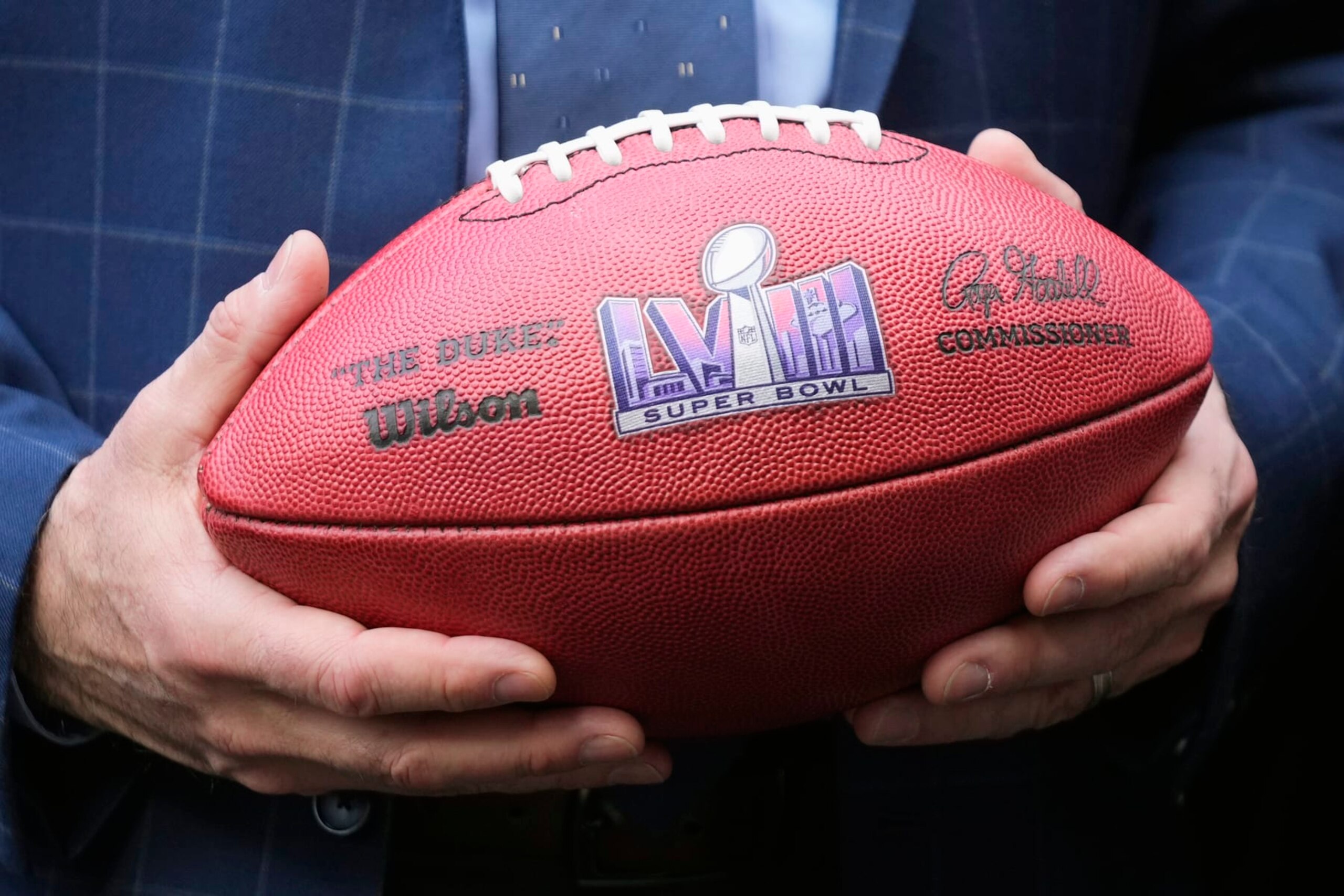 Nevada Republican Gov. Joe Lombardo holds an NFL football with the Super Bowl LVIII logo on it after the Arizona Super Bowl Host Committee handed off the ball to the Las Vegas Super Bowl Host Committee for Super Bowl LVIII during an NFL Super Bowl football game news conference in Phoenix, Monday, Feb. 13, 2023. (AP Photo/Ross D. Franklin) Nevada Republican Gov. Joe Lombardo holds an NFL football with the Super Bowl LVIII logo on it after the Arizona Super Bowl Host Committee handed off the ball to the Las Vegas Super Bowl Host Committee for Super Bowl LVIII during an NFL Super Bowl football game news conference in Phoenix, Monday, Feb. 13, 2023. (AP Photo/Ross D. Franklin)
