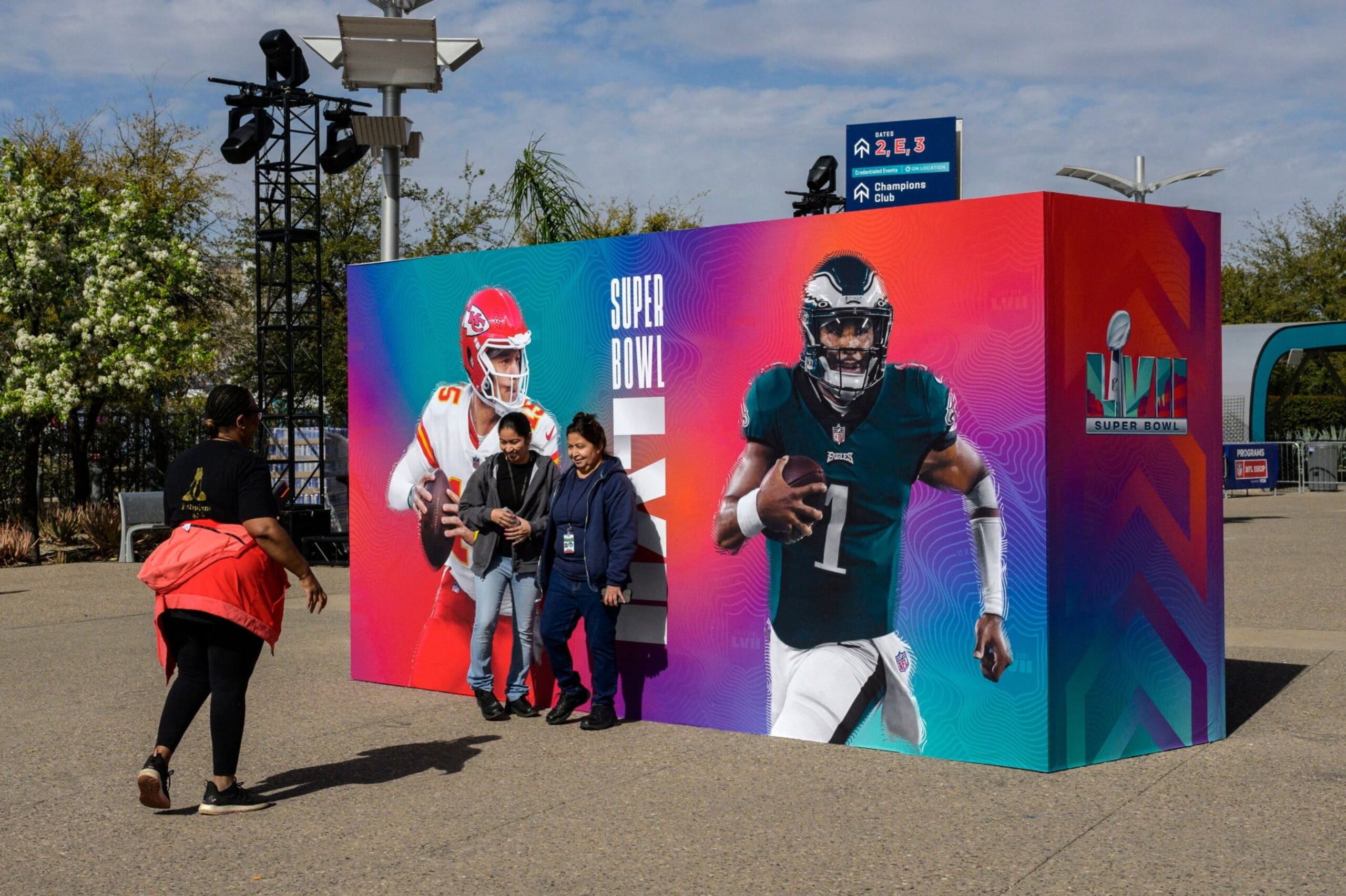 Football fans take pictures with a backdrop showing Kansas City Chiefs' quarterback Patrick Mahomes (L) and Philadelphia Eagles' quarterback Jalen Hurts ahead of Super Bowl LVII between the Philadelphia Eagles and the Kansas City Chiefs at State Farm Stadium in Glendale, Arizona, on February 11, 2023. (Photo by ANGELA WEISS / AFP) (Photo by ANGELA WEISS/AFP via Getty Images) Football fans take pictures with a backdrop showing Kansas City Chiefs' quarterback Patrick Mahomes (L) and Philadelphia Eagles' quarterback Jalen Hurts ahead of Super Bowl LVII between the Philadelphia Eagles and the Kansas City Chiefs at State Farm Stadium in Glendale, Arizona, on February 11, 2023. (Photo by ANGELA WEISS / AFP) (Photo by ANGELA WEISS/AFP via Getty Images)