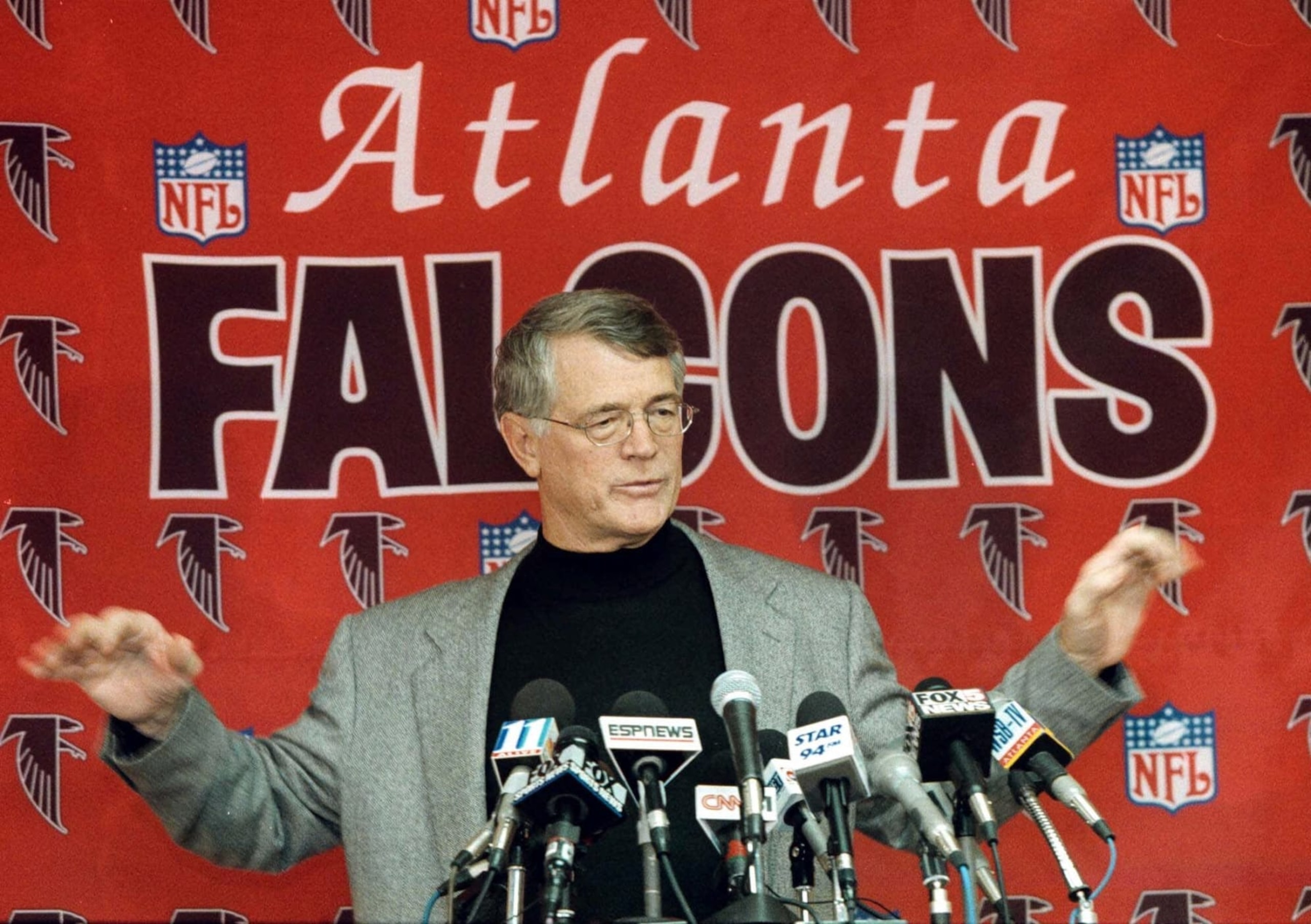Atlanta Falcons coach Dan Reeves does his rendition of the Drity Bird dance at a press conference in Suwanee, Ga. Monday Jan. 18,1999. The Falcons defeated the Vikings 30-27 Sunday to win the NFC Championship. (AP Photo/Wilford Harewood)
