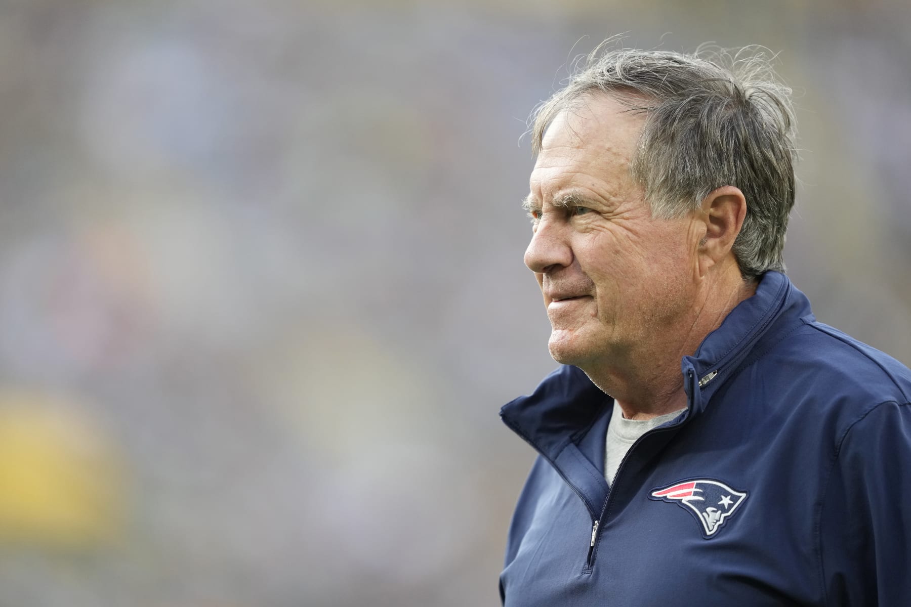 GREEN BAY, WISCONSIN - AUGUST 19: Head coach Bill Belichick of the New England Patriots looks on before a preseason game against the Green Bay Packers at Lambeau Field on August 19, 2023 in Green Bay, Wisconsin. (Photo by Patrick McDermott/Getty Images)
