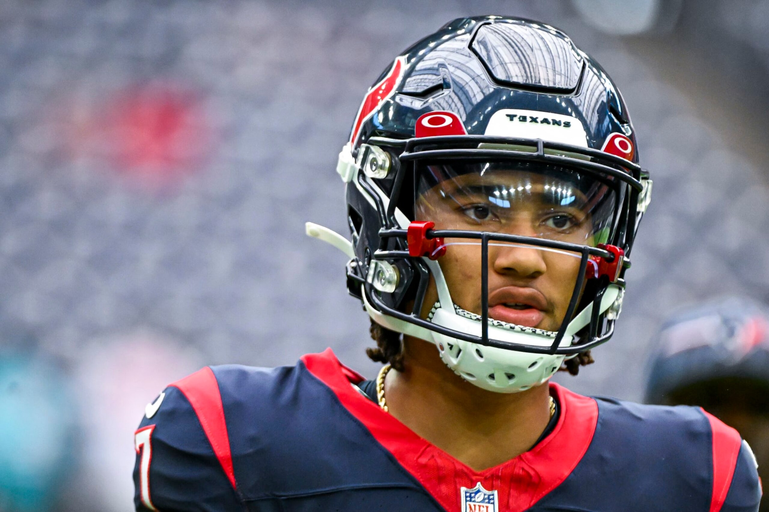 HOUSTON, TEXAS - AUGUST 19: C.J. Stroud #7 of the Houston Texans warms up prior to the preseason game against the Miami Dolphins at NRG Stadium on August 19, 2023 in Houston, Texas. (Photo by Logan Riely/Getty Images)