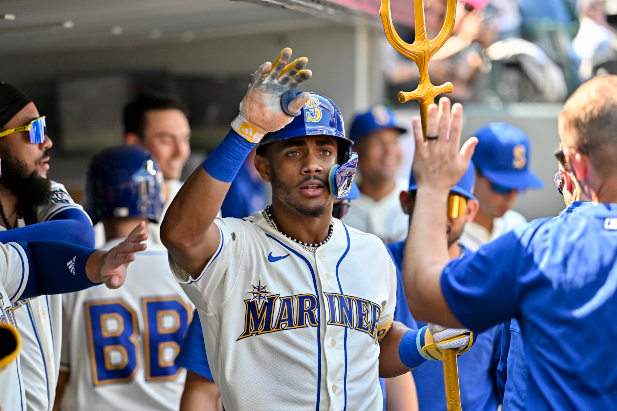 SEATTLE, WASHINGTON - AUGUST 27: Julio Rodriguez #44 of the Seattle Mariners celebrates with teammates after hitting a two-run home run during the fifth inning against the Kansas City Royals at T-Mobile Park on August 27, 2023 in Seattle, Washington. (Photo by Alika Jenner/Getty Images)