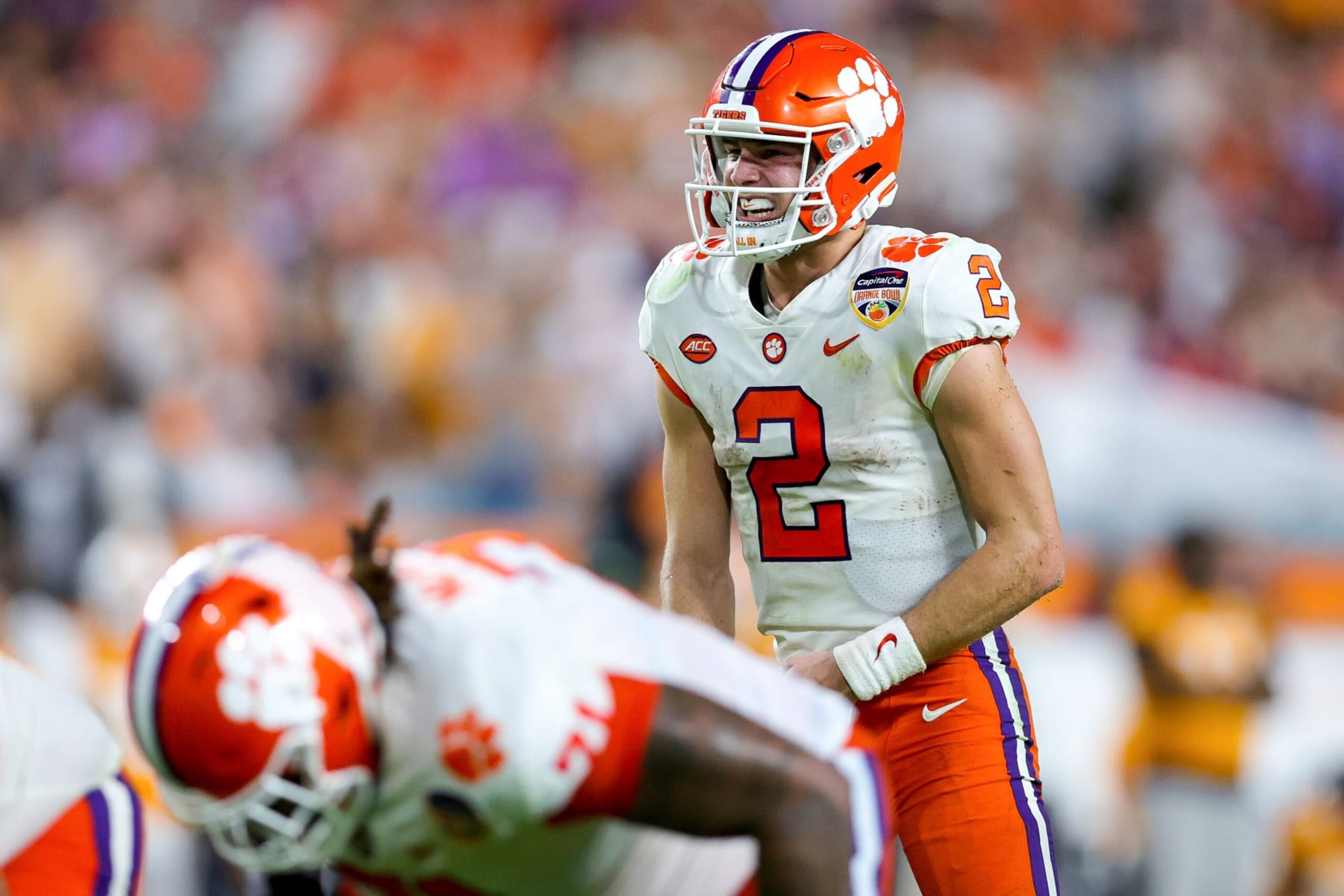 MIAMI GARDENS, FLORIDA - DECEMBER 30: Cade Klubnik #2 of the Clemson Tigers looks on at the line of scrimmage against the Tennessee Volunteers during the second half in theCapital One Orange Bowl at Hard Rock Stadium on December 30, 2022 in Miami Gardens, Florida. (Photo by Megan Briggs/Getty Images)