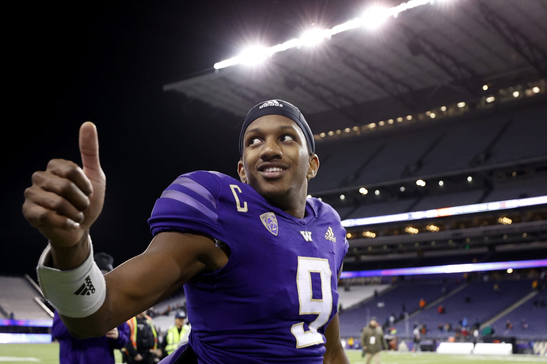SEATTLE, WASHINGTON - NOVEMBER 04: Michael Penix Jr. #9 of the Washington Huskies celebrates after beating Oregon State Beavers 24-21 at Husky Stadium on November 04, 2022 in Seattle, Washington. (Photo by Steph Chambers/Getty Images)
