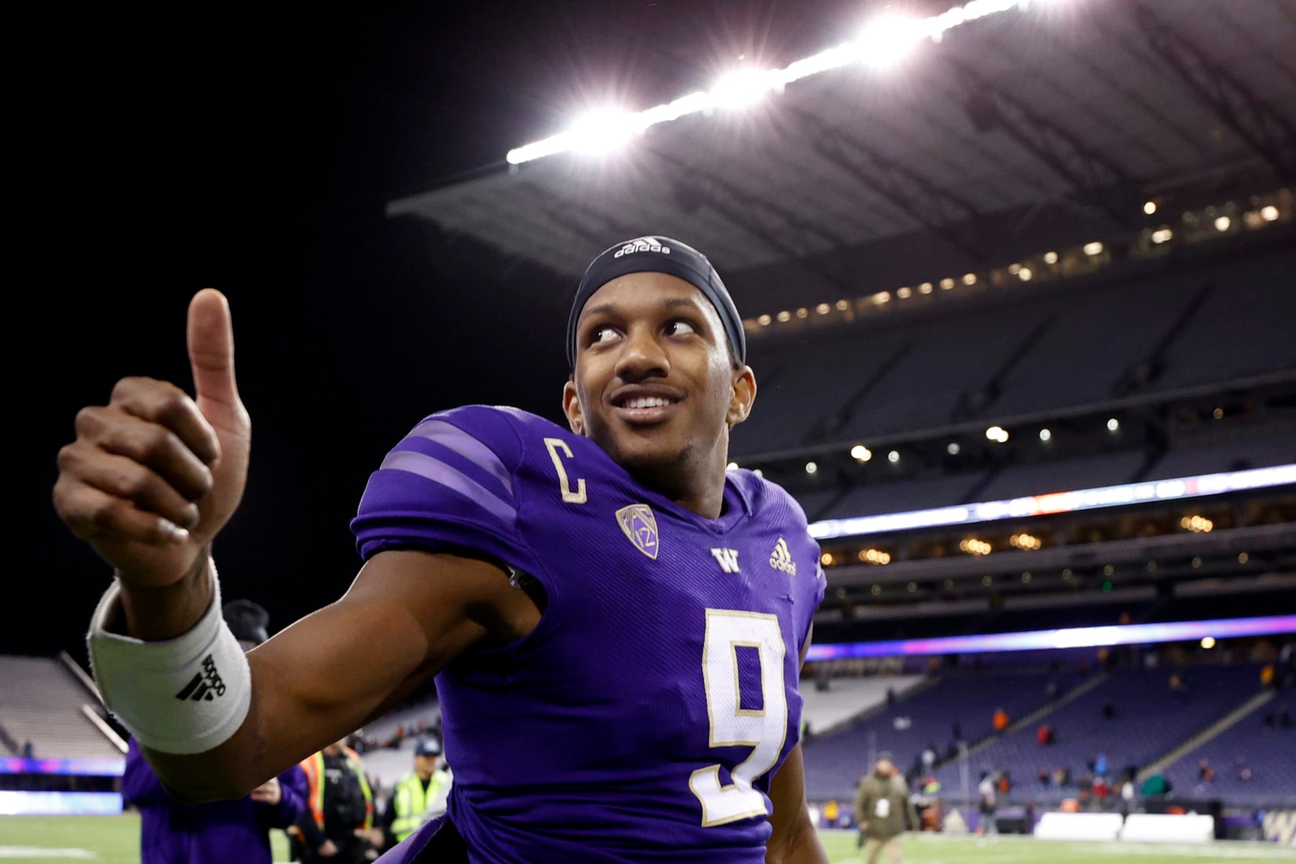 SEATTLE, WASHINGTON - NOVEMBER 04: Michael Penix Jr. #9 of the Washington Huskies celebrates after beating Oregon State Beavers 24-21 at Husky Stadium on November 04, 2022 in Seattle, Washington. (Photo by Steph Chambers/Getty Images)