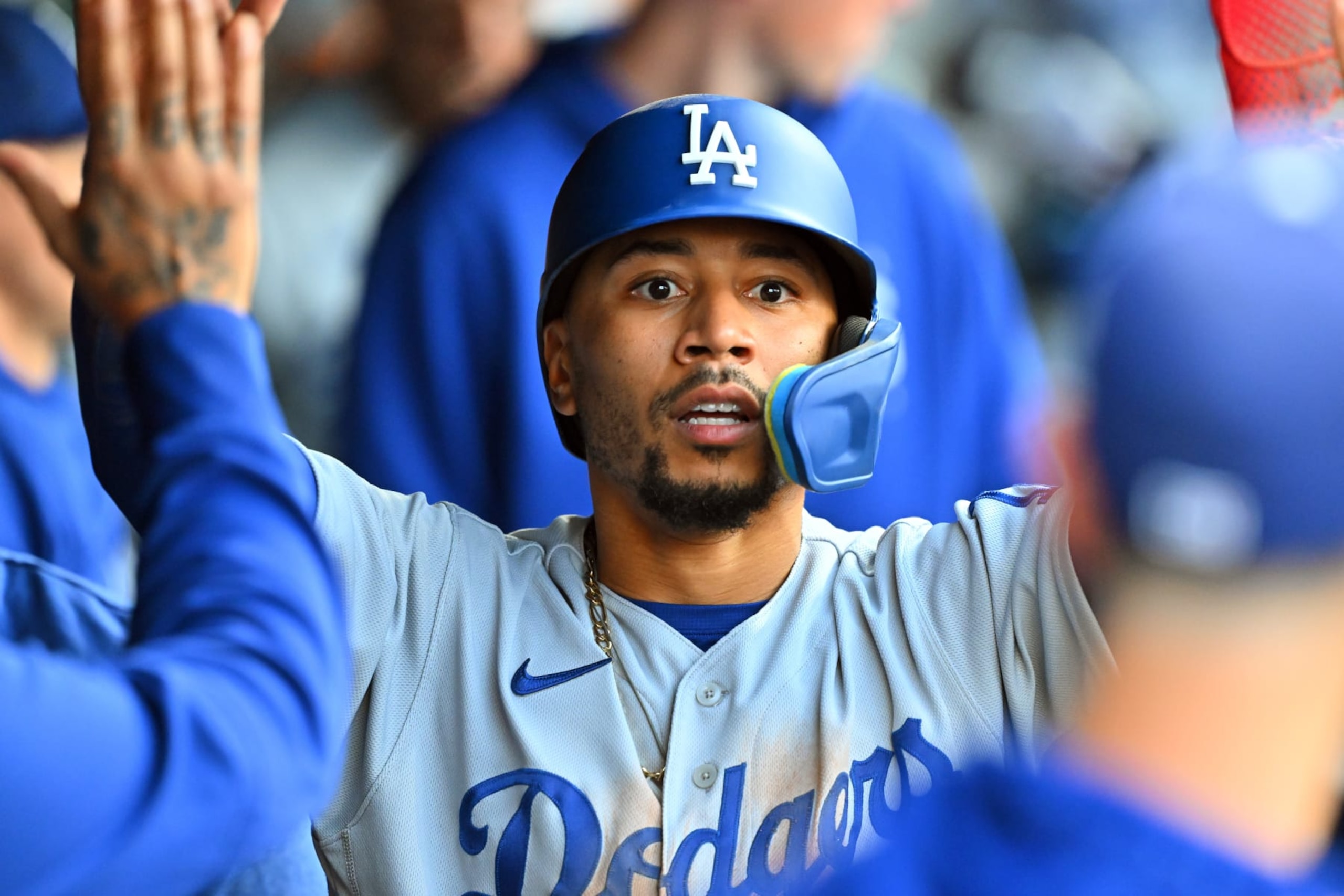 CLEVELAND, OHIO - AUGUST 22: Mookie Betts #50 of the Los Angeles Dodgers celebrates with teammates in the dugout after scoring during the third inning against the Cleveland Guardians at Progressive Field on August 22, 2023 in Cleveland, Ohio. (Photo by Jason Miller/Getty Images)