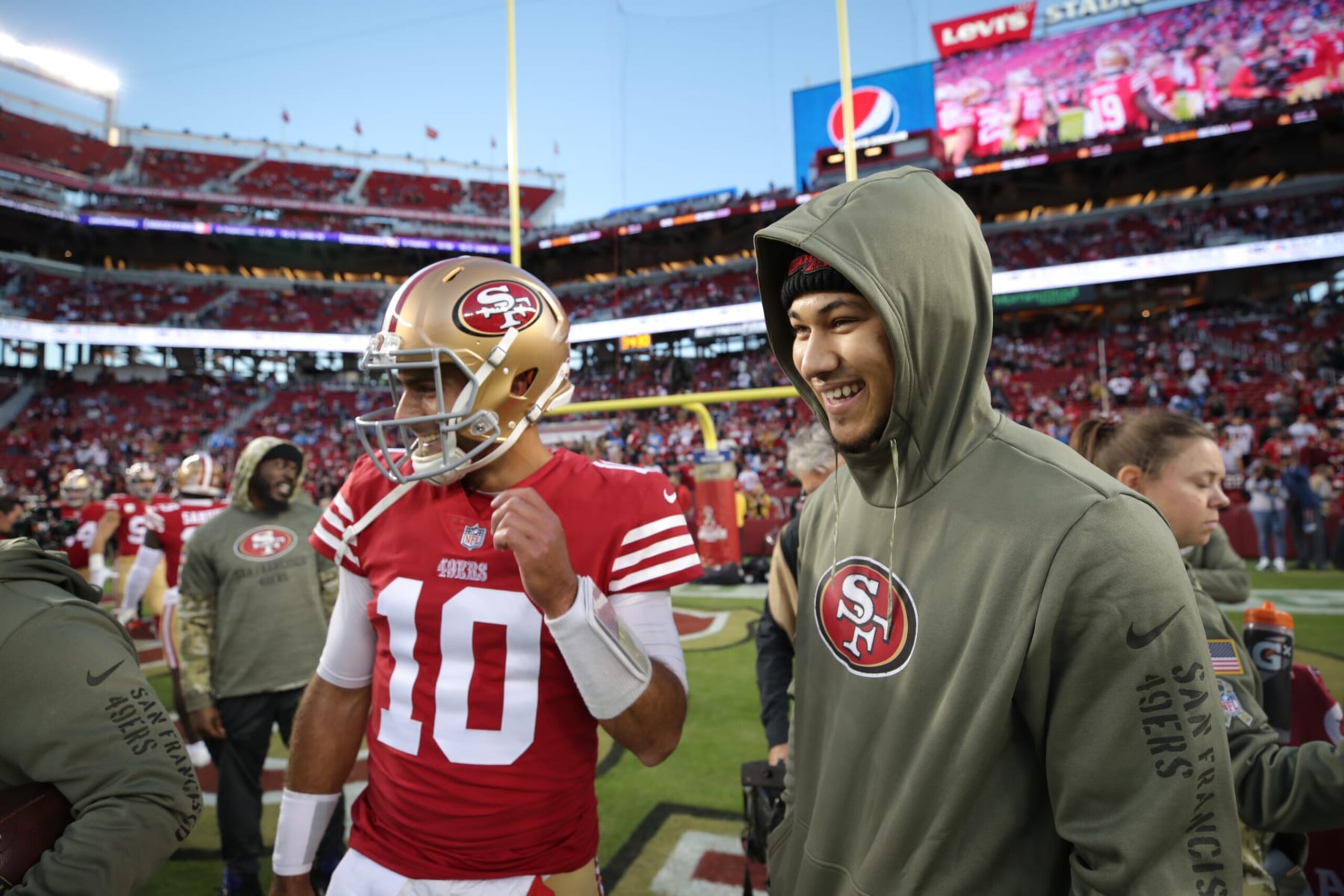 SANTA CLARA, CA - NOVEMBER 13: Jimmy Garoppolo #10 and Trey Lance #5 of the San Francisco 49ers on the field before the game against the Los Angeles Chargers at Levi's Stadium on November 13, 2022 in Santa Clara, California. The 49ers defeated the Chargers 22-16. (Photo by Michael Zagaris/San Francisco 49ers/Getty Images)