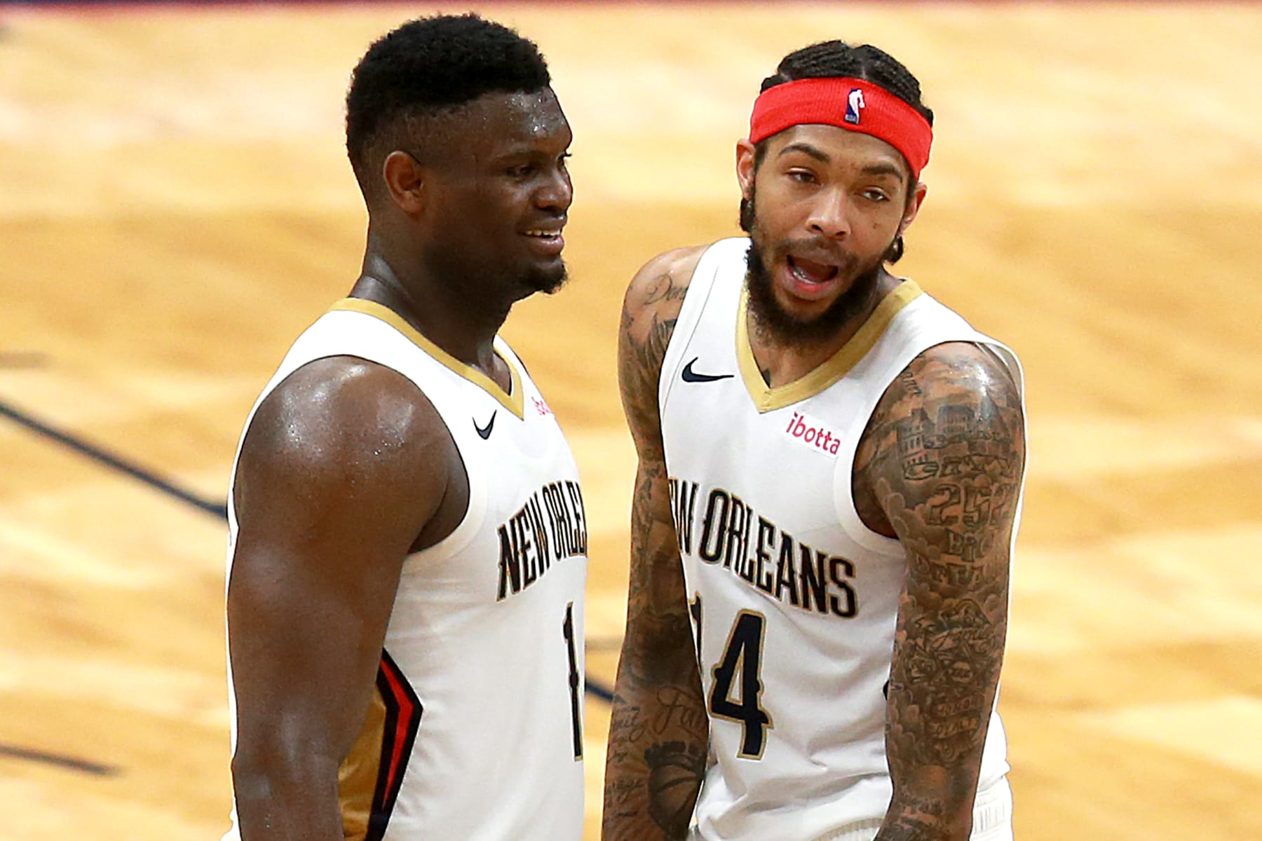 NEW ORLEANS, LOUISIANA - APRIL 12: Zion Williamson #1 of the New Orleans Pelicans and Brandon Ingram #14 of the New Orleans Pelicans stand on the court during the fourth quarter of an NBA game against the Sacramento Kings at Smoothie King Center on April 12, 2021 in New Orleans, Louisiana. The New Orleans Pelicans won the game 117 - 110. NOTE TO USER: User expressly acknowledges and agrees that, by downloading and or using this photograph, User is consenting to the terms and conditions of the Getty Images License Agreement. (Photo by Sean Gardner/Getty Images)