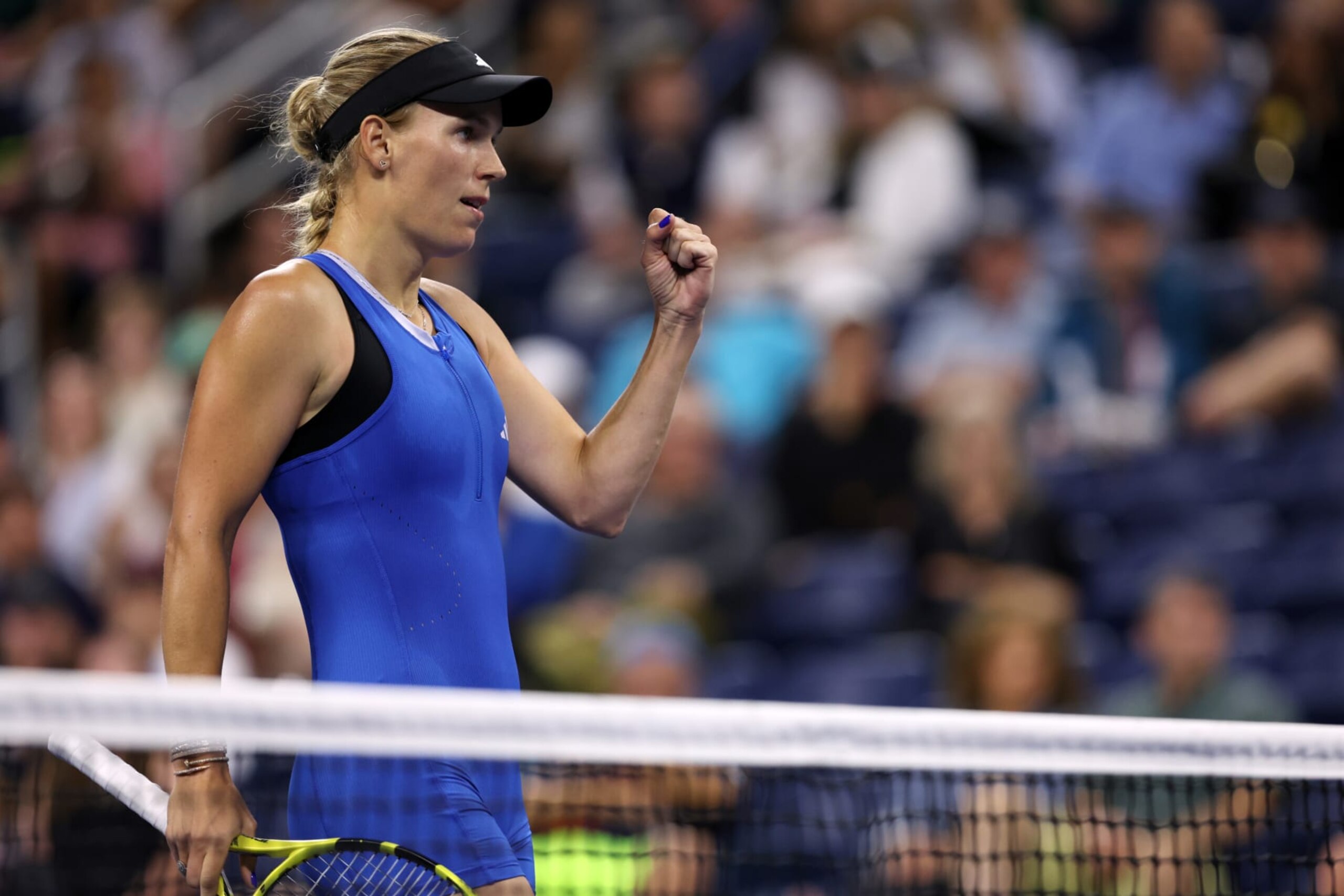 NEW YORK, NEW YORK - AUGUST 28: Caroline Wozniacki of Denmark celebrates a point against Tatiana Prozorova during their Women's Singles First Round match on Day One of the 2023 US Open at the USTA Billie Jean King National Tennis Center on August 28, 2023 in the Flushing neighborhood of the Queens borough of New York City. (Photo by Clive Brunskill/Getty Images)