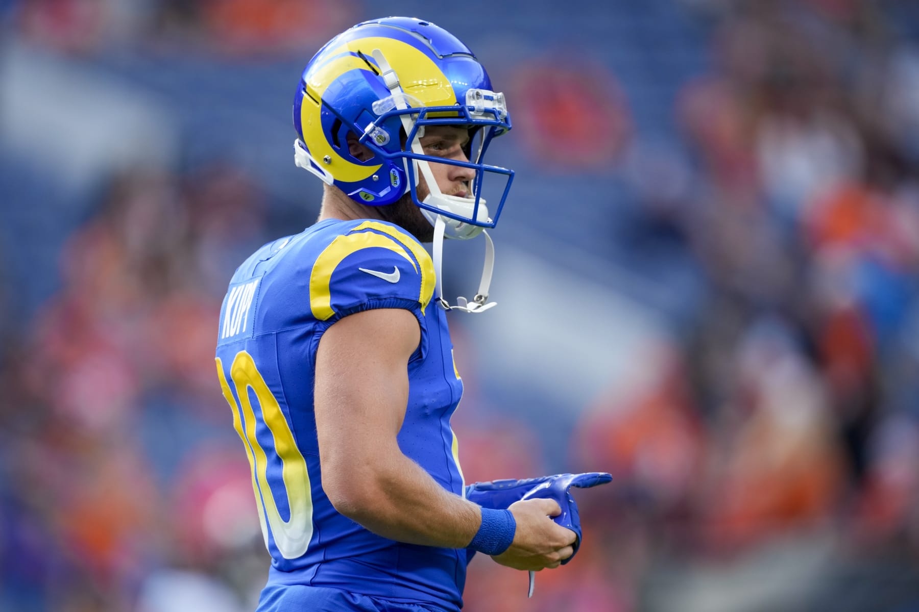 Los Angeles Rams wide receiver Cooper Kupp watches during warm ups before of an NFL preseason football game against the Denver Broncos Saturday, Aug. 26, 2023, in Denver. (AP Photo/David Zalubowski)