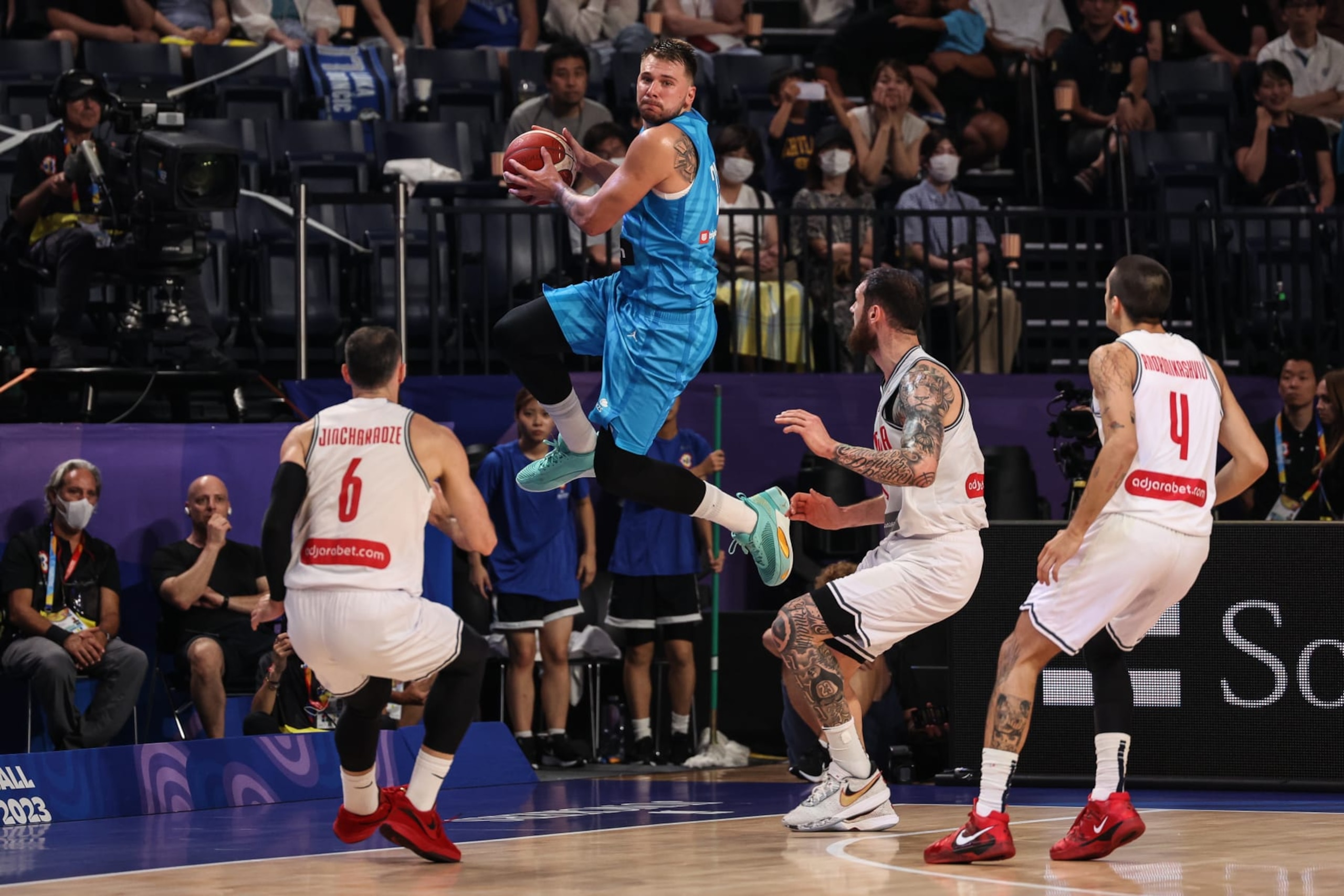 OKINAWA, JAPAN - AUGUST 28: Luka Doncic #77 of Slovenia passes the ball during the FIBA Basketball World Cup Group F game between Georgia and Slovenia at Okinawa Arena on August 28, 2023 in Okinawa, Japan. (Photo by Takashi Aoyama/Getty Images) OKINAWA, JAPAN - AUGUST 28: Luka Doncic #77 of Slovenia passes the ball during the FIBA Basketball World Cup Group F game between Georgia and Slovenia at Okinawa Arena on August 28, 2023 in Okinawa, Japan. (Photo by Takashi Aoyama/Getty Images)