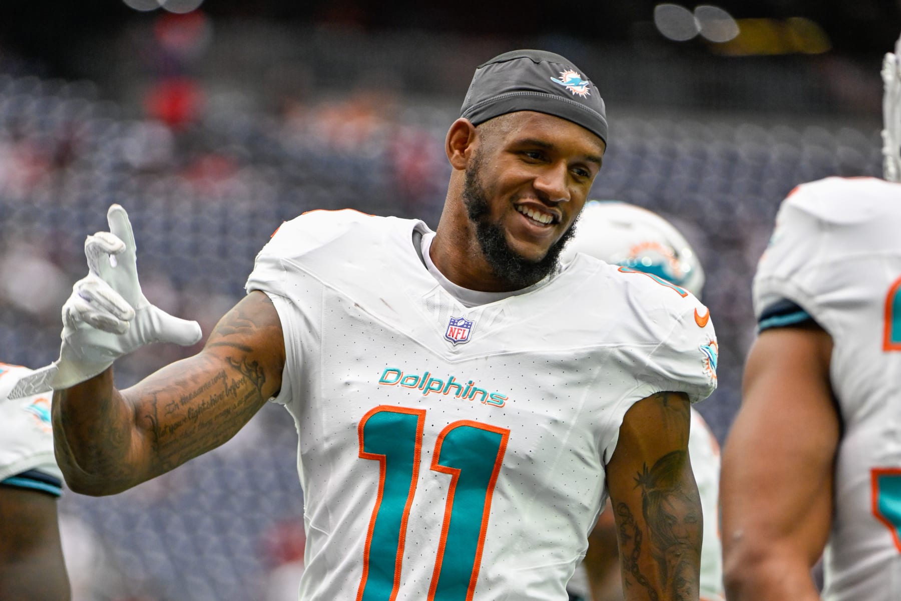 HOUSTON, TX - AUGUST 19: Miami Dolphins wide receiver Cedrick Wilson Jr. (11) shares a laugh with teammates before the football game between the Miami Dolphins and Houston Texans at NRG Stadium on August, 19, 2023 in Houston, Texas. (Photo by Ken Murray/Icon Sportswire via Getty Images)