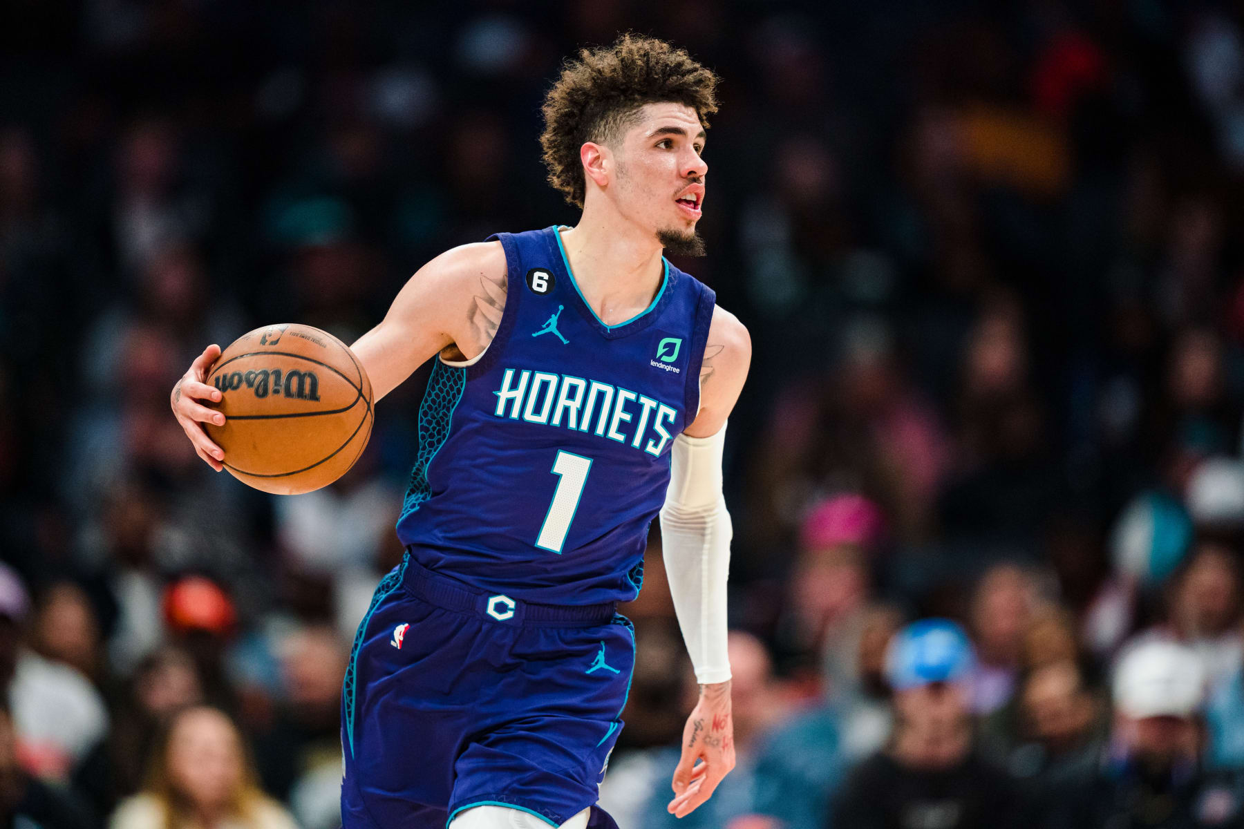 CHARLOTTE, NORTH CAROLINA - FEBRUARY 25: LaMelo Ball #1 of the Charlotte Hornets brings the ball up court in the first quarter during their game against the Miami Heat at Spectrum Center on February 25, 2023 in Charlotte, North Carolina. NOTE TO USER: User expressly acknowledges and agrees that, by downloading and or using this photograph, User is consenting to the terms and conditions of the Getty Images License Agreement. (Photo by Jacob Kupferman/Getty Images)
