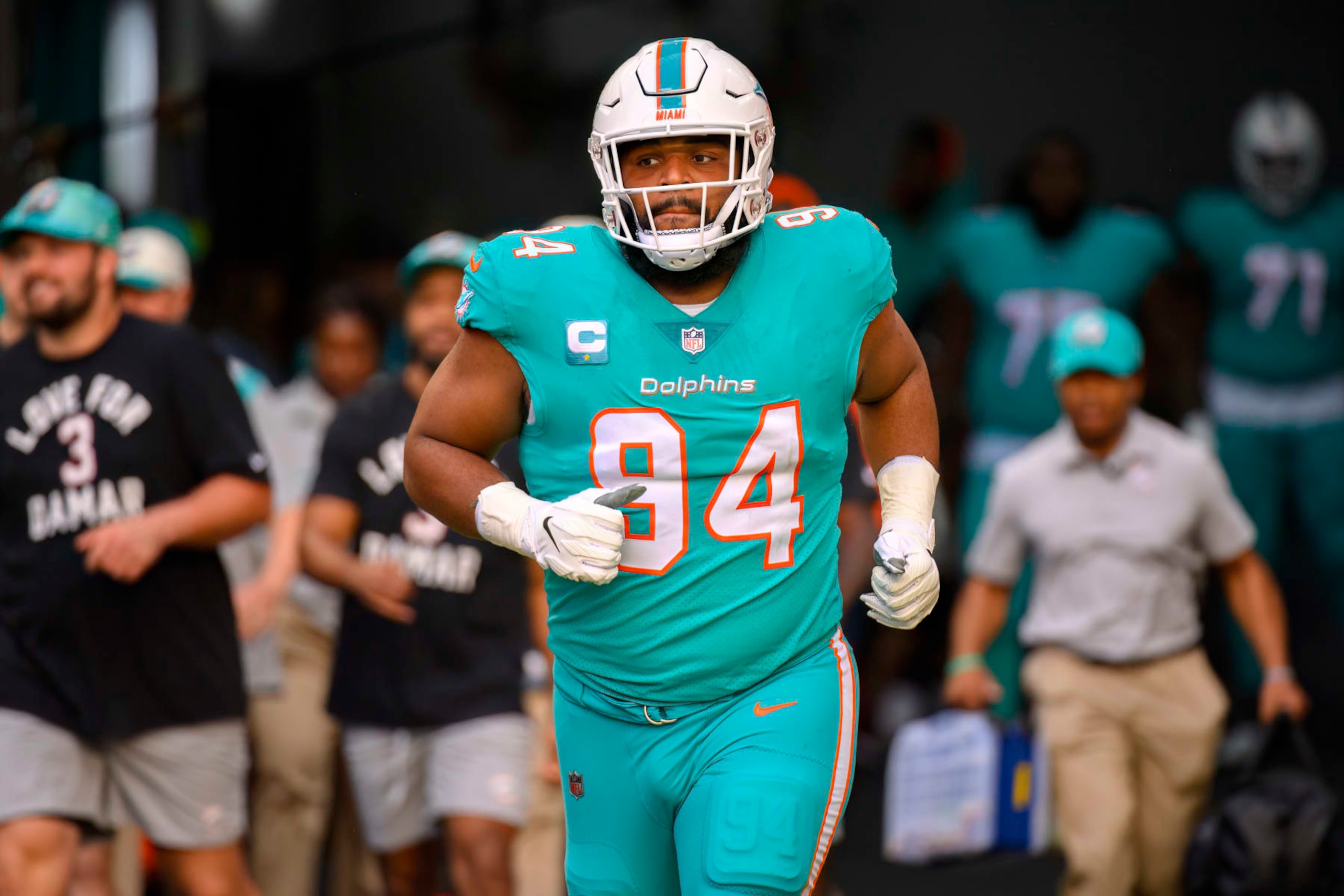 Miami Dolphins defensive tackle Christian Wilkins (94) runs onto the field before an NFL football game against the New York Jets, Sunday, Jan. 8, 2023, in Miami Gardens, Fla. (AP Photo/Doug Murray)