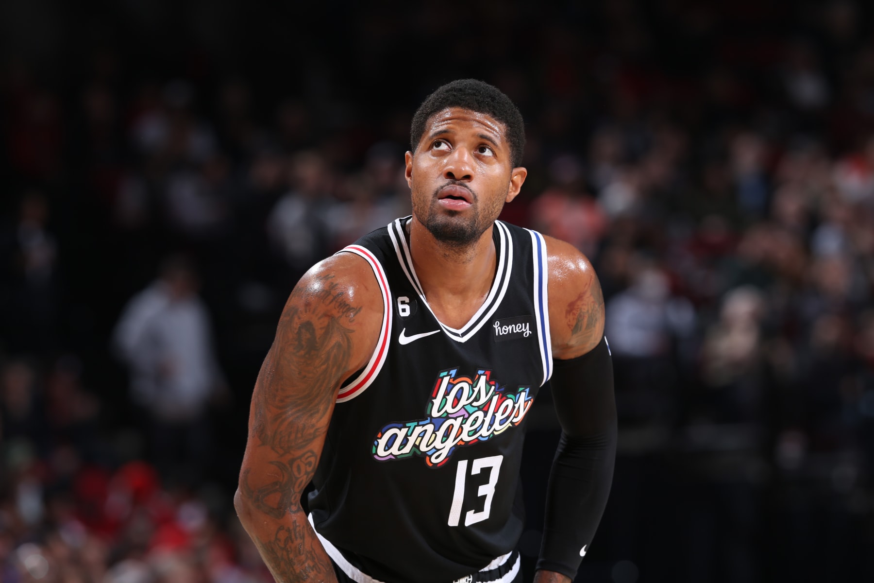 PORTLAND, OR - MARCH 19: Paul George #13 of the LA Clippers looks on during the game against the Portland Trail Blazers on March 19, 2023 at the Moda Center Arena in Portland, Oregon. NOTE TO USER: User expressly acknowledges and agrees that, by downloading and or using this photograph, user is consenting to the terms and conditions of the Getty Images License Agreement. Mandatory Copyright Notice: Copyright 2023 NBAE (Photo by Sam Forencich/NBAE via Getty Images)