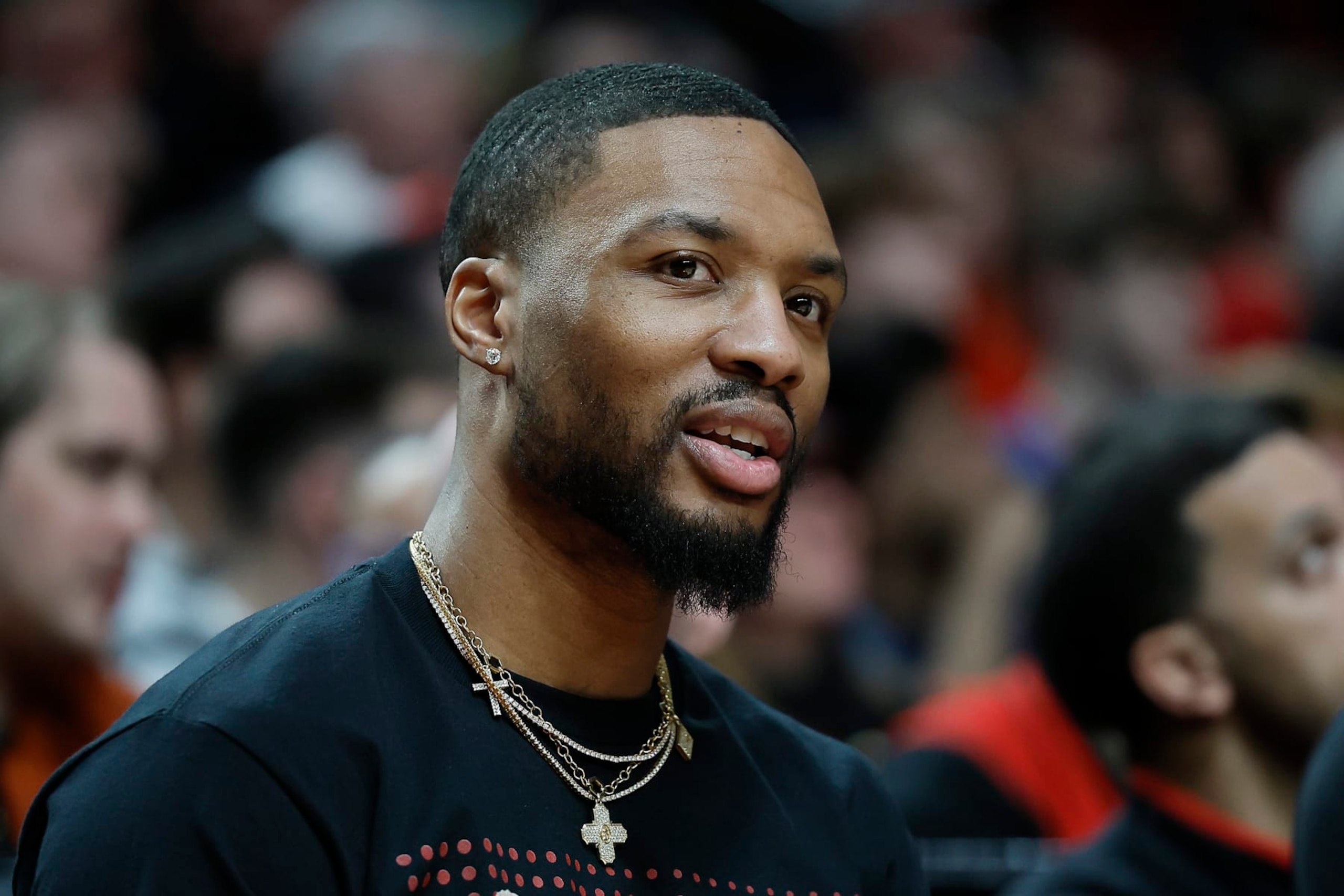PORTLAND, OREGON - MARCH 24: Damian Lillard #0 of the Portland Trail Blazers watches from the bench during the second half against the Chicago Bulls at Moda Center on March 24, 2023 in Portland, Oregon. NOTE TO USER: User expressly acknowledges and agrees that, by downloading and or using this photograph, User is consenting to the terms and conditions of the Getty Images License Agreement. (Photo by Soobum Im/Getty Images)
