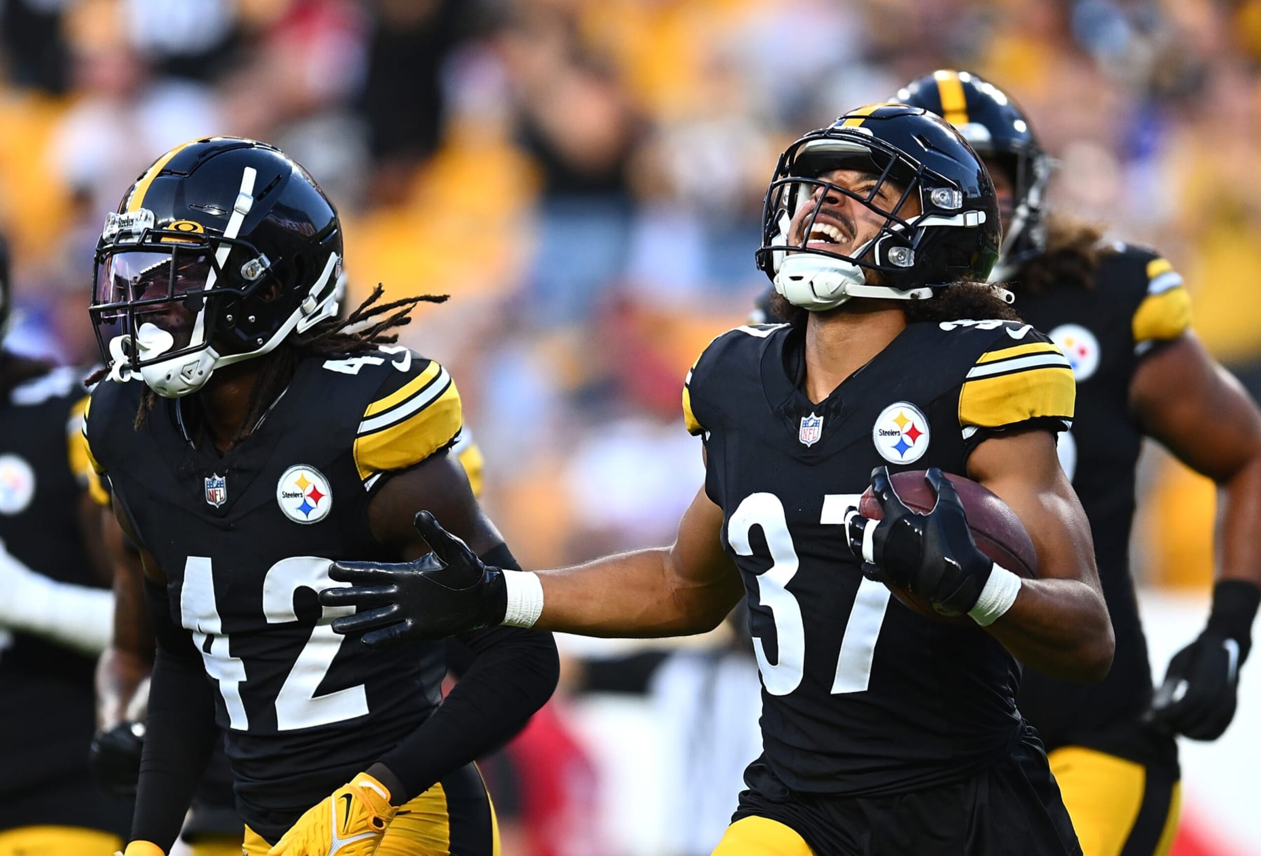 PITTSBURGH, PENNSYLVANIA - AUGUST 19:  Elijah Riley #37 of the Pittsburgh Steelers celebrates after intercepting a pass during the second quarter of a preseason game against the Buffalo Bills at Acrisure Stadium on August 19, 2023 in Pittsburgh, Pennsylvania. (Photo by Joe Sargent/Getty Images)