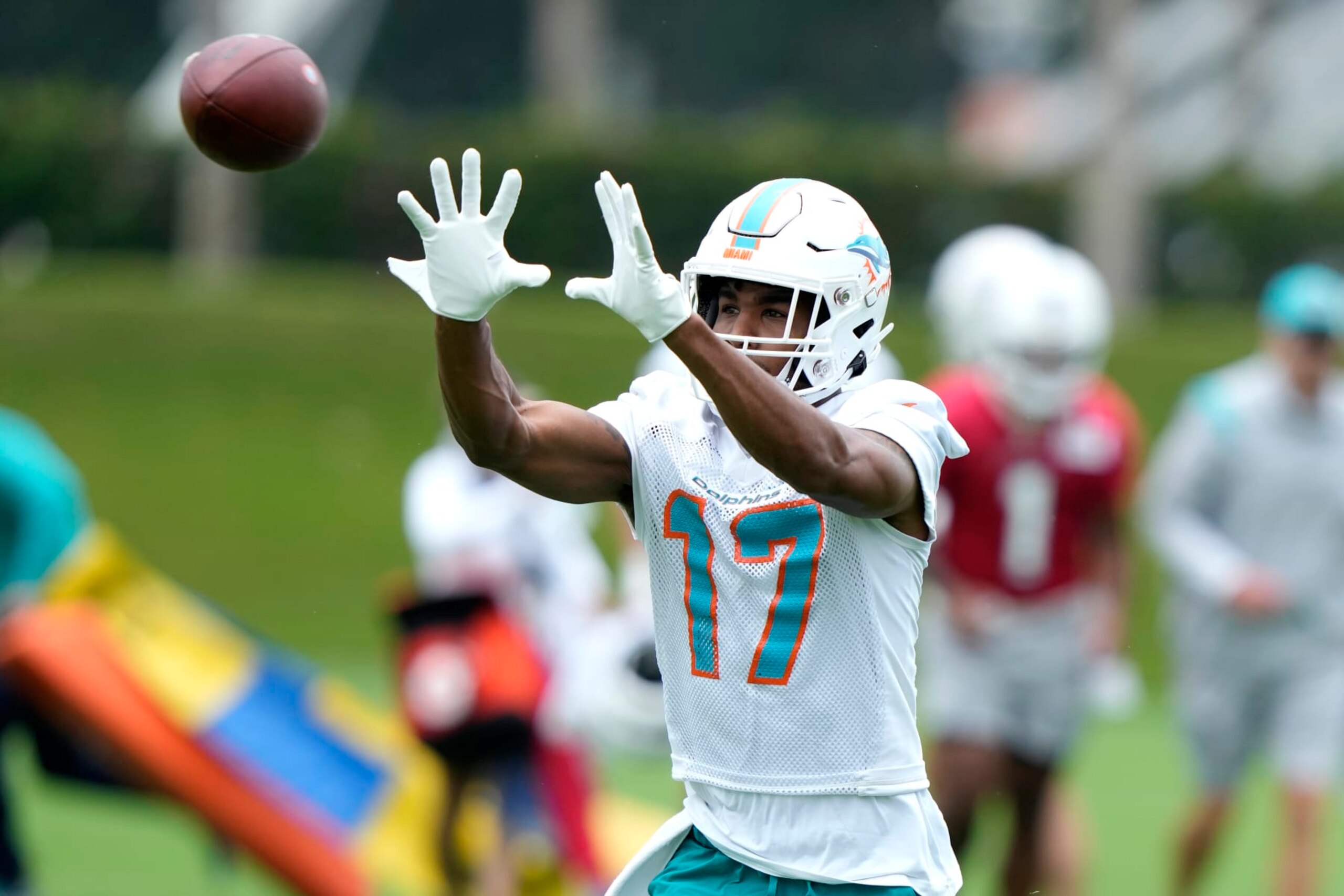 Miami Dolphins wide receiver Jaylen Waddle (17) does drills during practice at the NFL football team's training facility, Wednesday, July 26, 2023, in Miami Gardens, Fla. (AP Photo/Lynne Sladky)