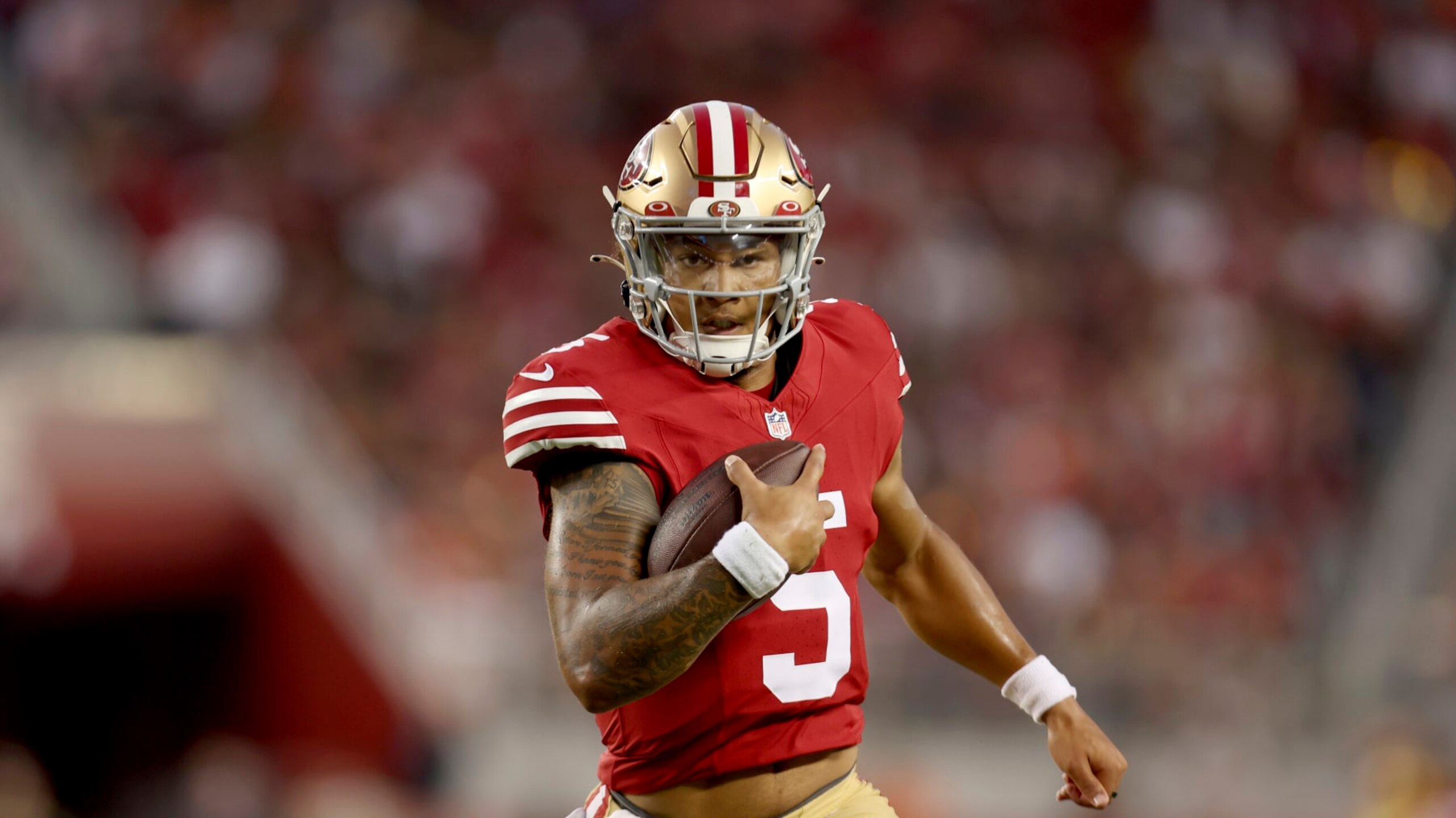 San Francisco 49ers quarterback Trey Lance (5) runs against the Denver Broncos during the second half of an NFL preseason football game in Santa Clara, Calif., Saturday, Aug. 19, 2023. (AP Photo/Jed Jacobsohn)