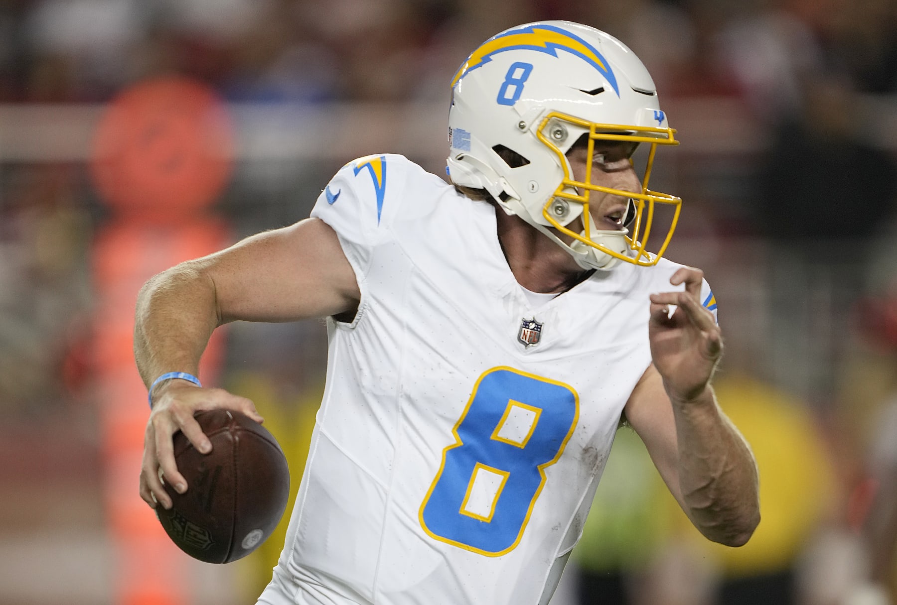 SANTA CLARA, CALIFORNIA - AUGUST 25: Max Duggan #8 of the Los Angeles Chargers runs with the ball against the San Francisco 49ers during the third quarter of a preseason game at Levi's Stadium on August 25, 2023 in Santa Clara, California. (Photo by Thearon W. Henderson/Getty Images)