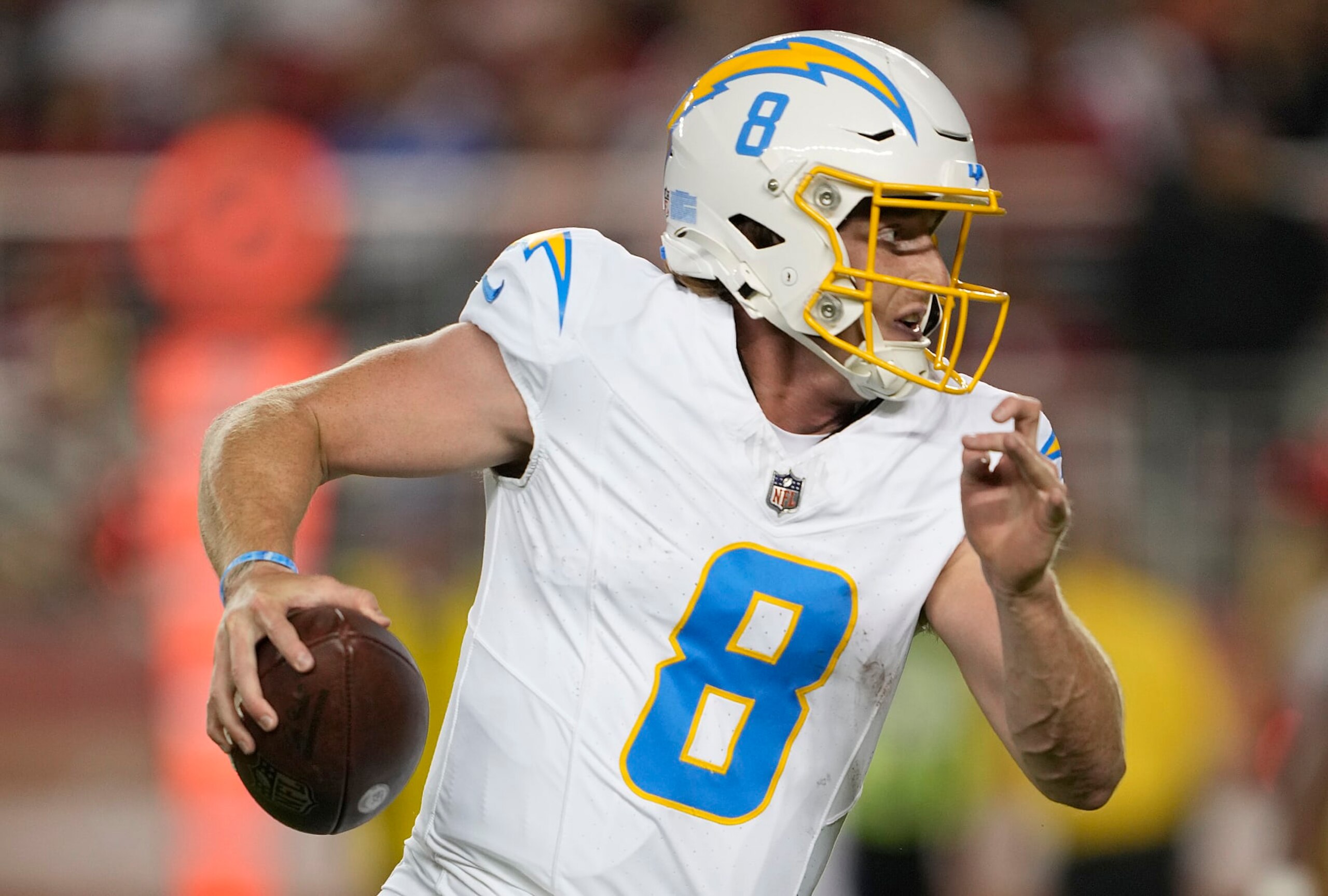 SANTA CLARA, CALIFORNIA - AUGUST 25: Max Duggan #8 of the Los Angeles Chargers runs with the ball against the San Francisco 49ers during the third quarter of a preseason game at Levi's Stadium on August 25, 2023 in Santa Clara, California. (Photo by Thearon W. Henderson/Getty Images)