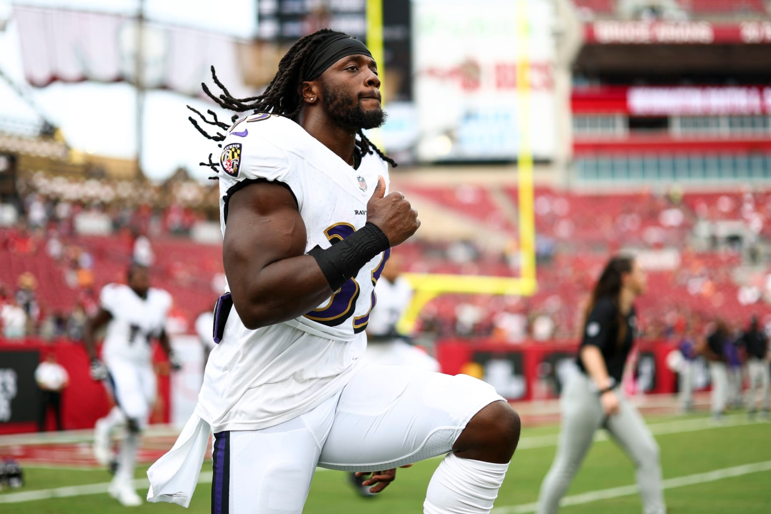 TAMPA, FL - AUGUST 26: Melvin Gordon III #33 of the Baltimore Ravens warms up prior to an NFL preseason football game against the Tampa Bay Buccaneers at Raymond James Stadium on August 26, 2023 in Tampa, Florida. (Photo by Kevin Sabitus/Getty Images)