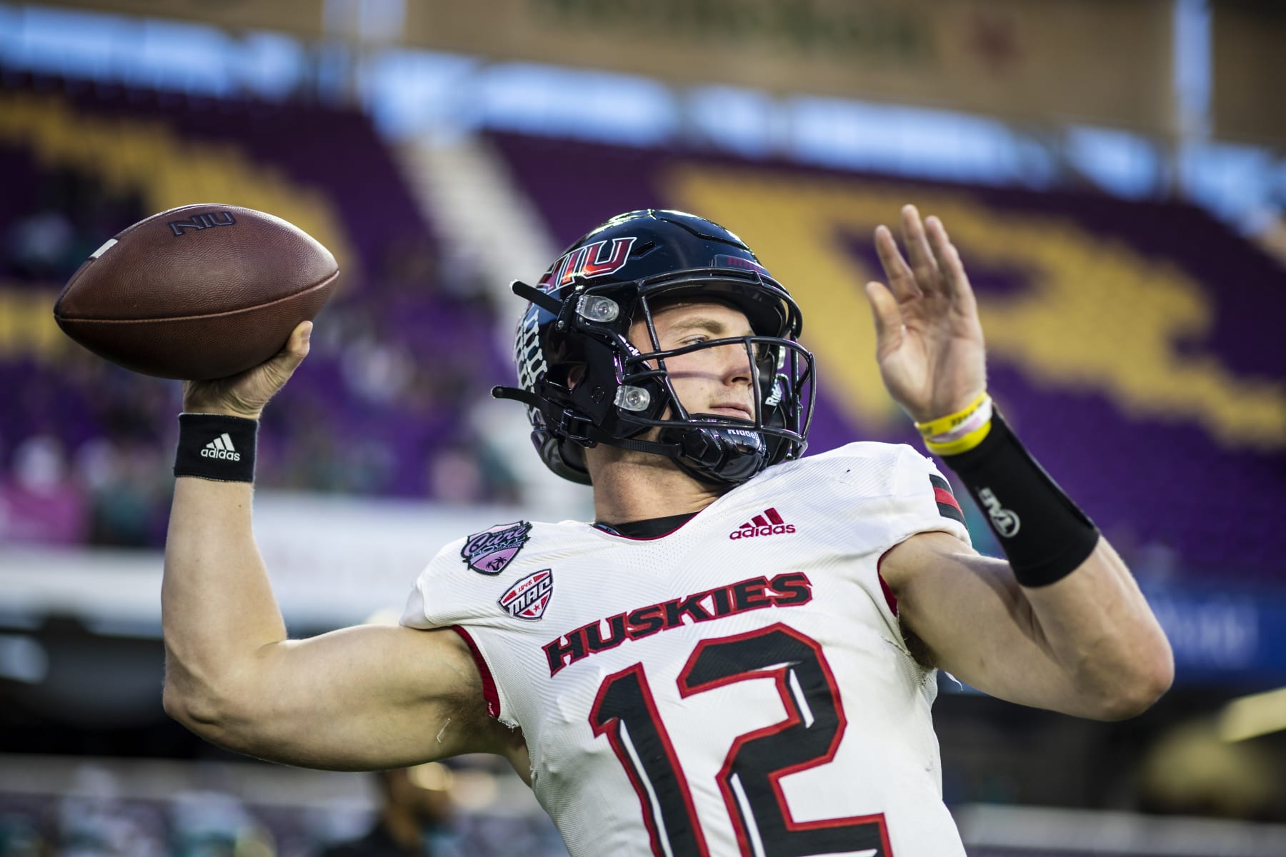 ORLANDO, FLORIDA - DECEMBER 17: Rocky Lombardi #12 of the Northern Illinois Huskies warms up before the start of the 2021 Cure Bowl against the Coastal Carolina Chanticleers at Exploria Stadium on December 17, 2021 in Orlando, Florida. (Photo by James Gilbert/Getty Images)