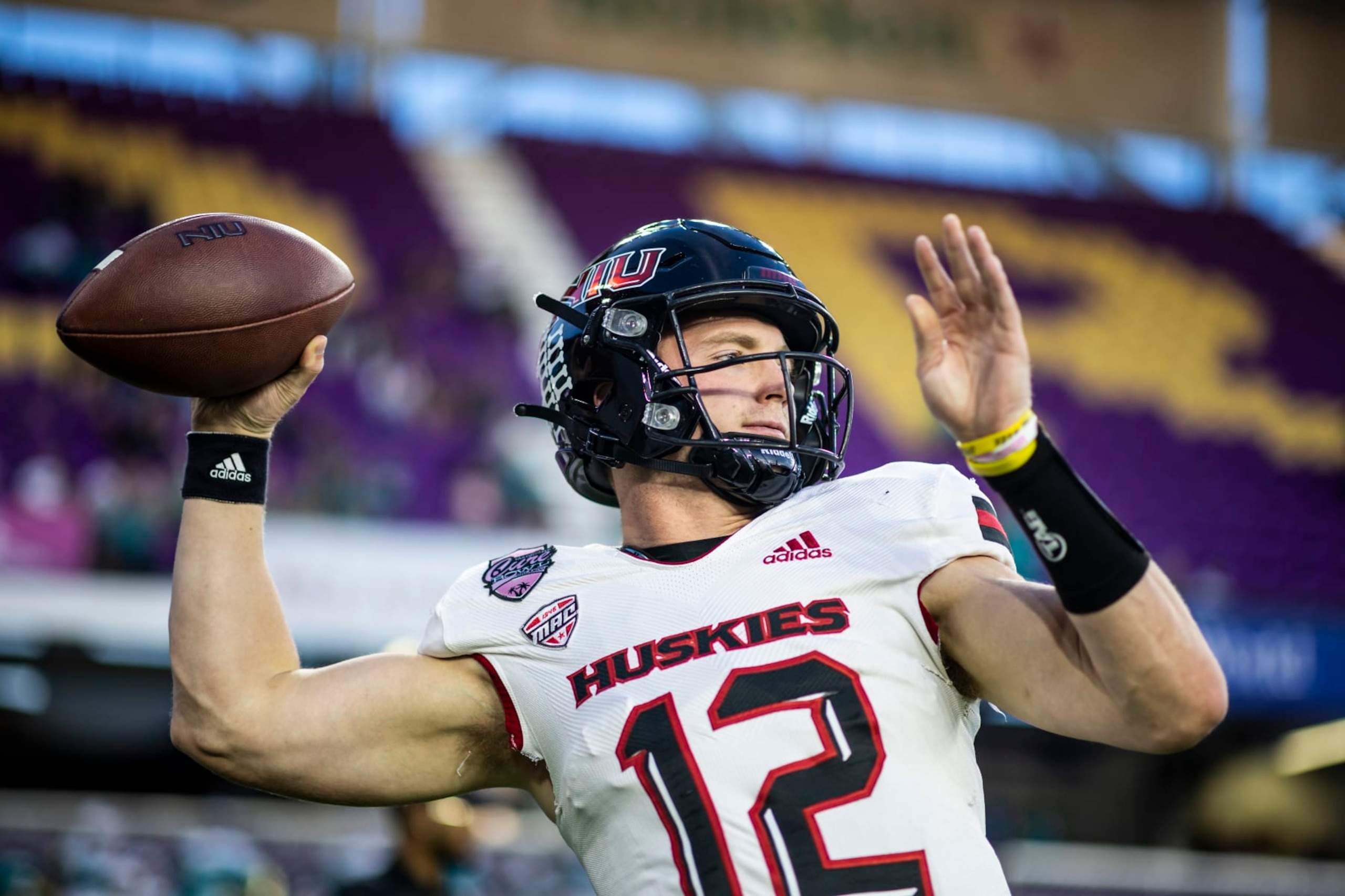ORLANDO, FLORIDA - DECEMBER 17: Rocky Lombardi #12 of the Northern Illinois Huskies warms up before the start of the 2021 Cure Bowl against the Coastal Carolina Chanticleers at Exploria Stadium on December 17, 2021 in Orlando, Florida. (Photo by James Gilbert/Getty Images)