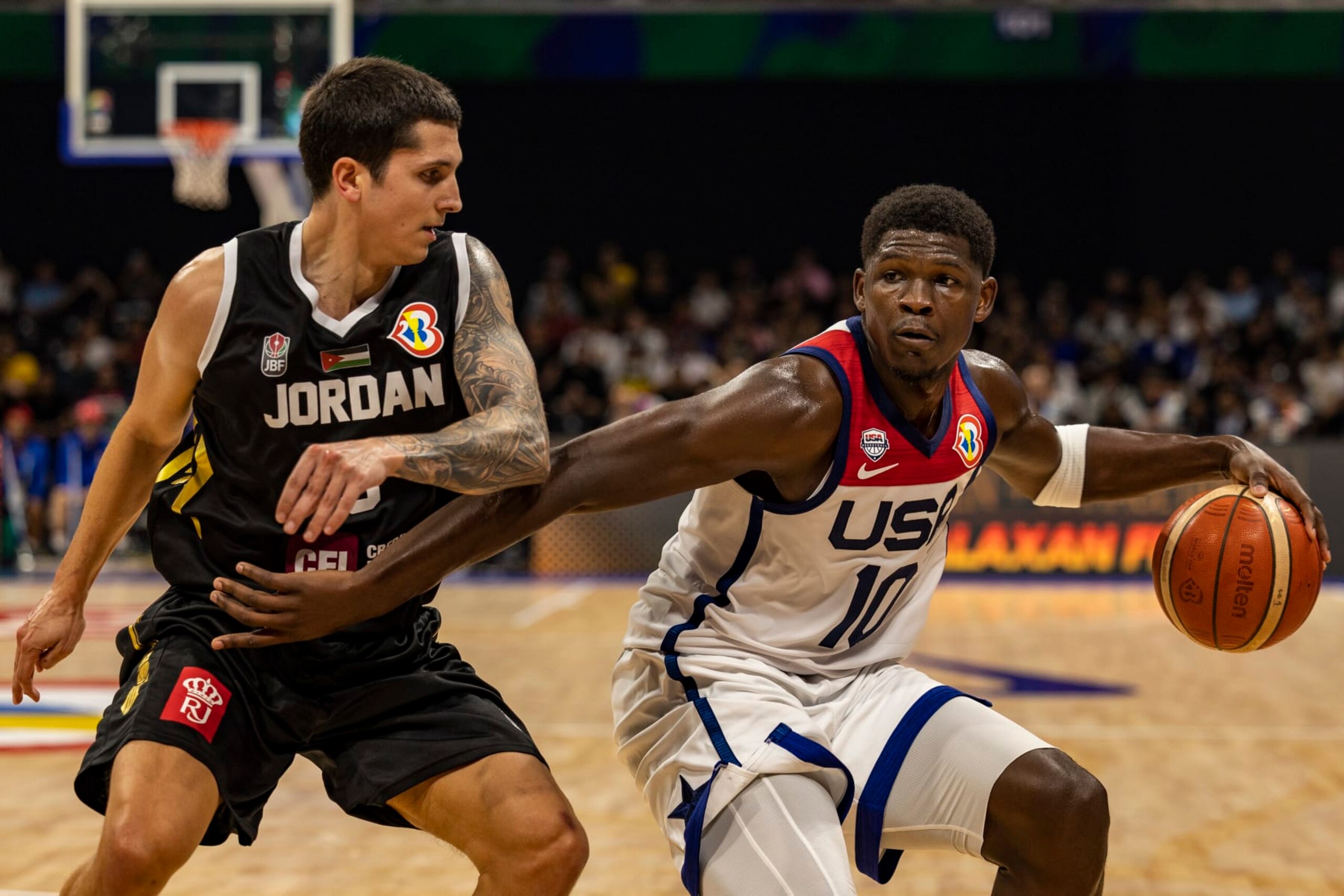 MANILA, PHILIPPINES - AUGUST 30: Anthony Edwards #10 of USA drives to the basket against Sami Bzai #9 of Jordan during the FIBA Basketball World Cup Group C game between United States and Jordan at Mall of Asia Arena on August 30, 2023 in Pasay, Metro Manila, Philippines. (Photo by Ezra Acayan/Getty Images)