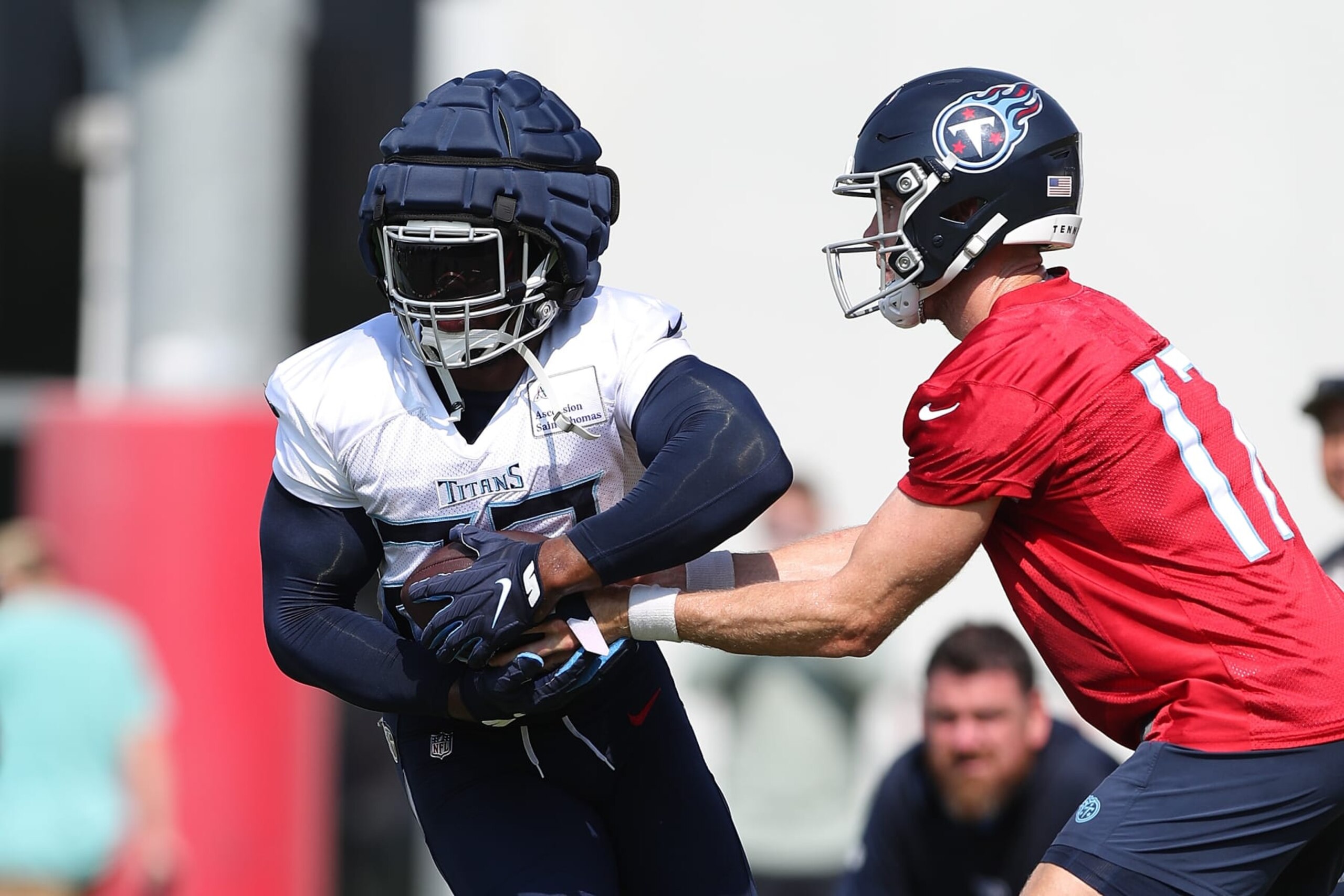 NASHVILLE, TENNESSEE - JULY 29: Ryan Tannehill #17 of the Tennessee Titans hands the ball off to Derrick Henry #22 of the Tennessee Titans during training camp at Ascension Saint Thomas Sports Park on July 29, 2023 in Nashville, Tennessee. (Photo by Justin Ford/Getty Images)