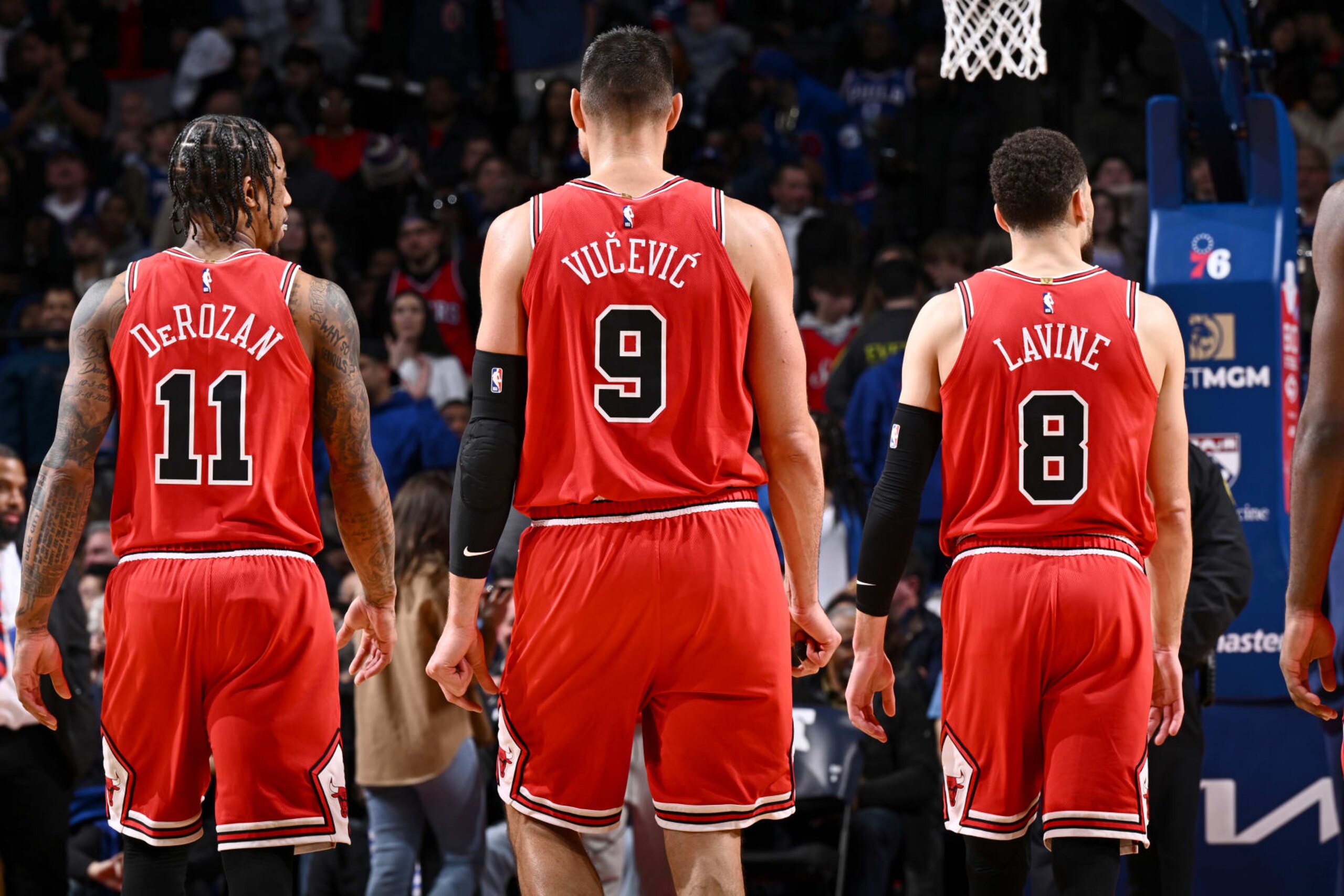 PHILADELPHIA, PA - MARCH 20: DeMar DeRozan #11, Nikola Vucevic #9 and Zach LaVine #8 of the Chicago Bulls look on during the game against the Philadelphia 76ers on March 20, 2023 at the Wells Fargo Center in Philadelphia, Pennsylvania NOTE TO USER: User expressly acknowledges and agrees that, by downloading and/or using this Photograph, user is consenting to the terms and conditions of the Getty Images License Agreement. Mandatory Copyright Notice: Copyright 2023 NBAE (Photo by David Dow/NBAE via Getty Images) PHILADELPHIA, PA - MARCH 20: DeMar DeRozan #11, Nikola Vucevic #9 and Zach LaVine #8 of the Chicago Bulls look on during the game against the Philadelphia 76ers on March 20, 2023 at the Wells Fargo Center in Philadelphia, Pennsylvania NOTE TO USER: User expressly acknowledges and agrees that, by downloading and/or using this Photograph, user is consenting to the terms and conditions of the Getty Images License Agreement. Mandatory Copyright Notice: Copyright 2023 NBAE (Photo by David Dow/NBAE via Getty Images)