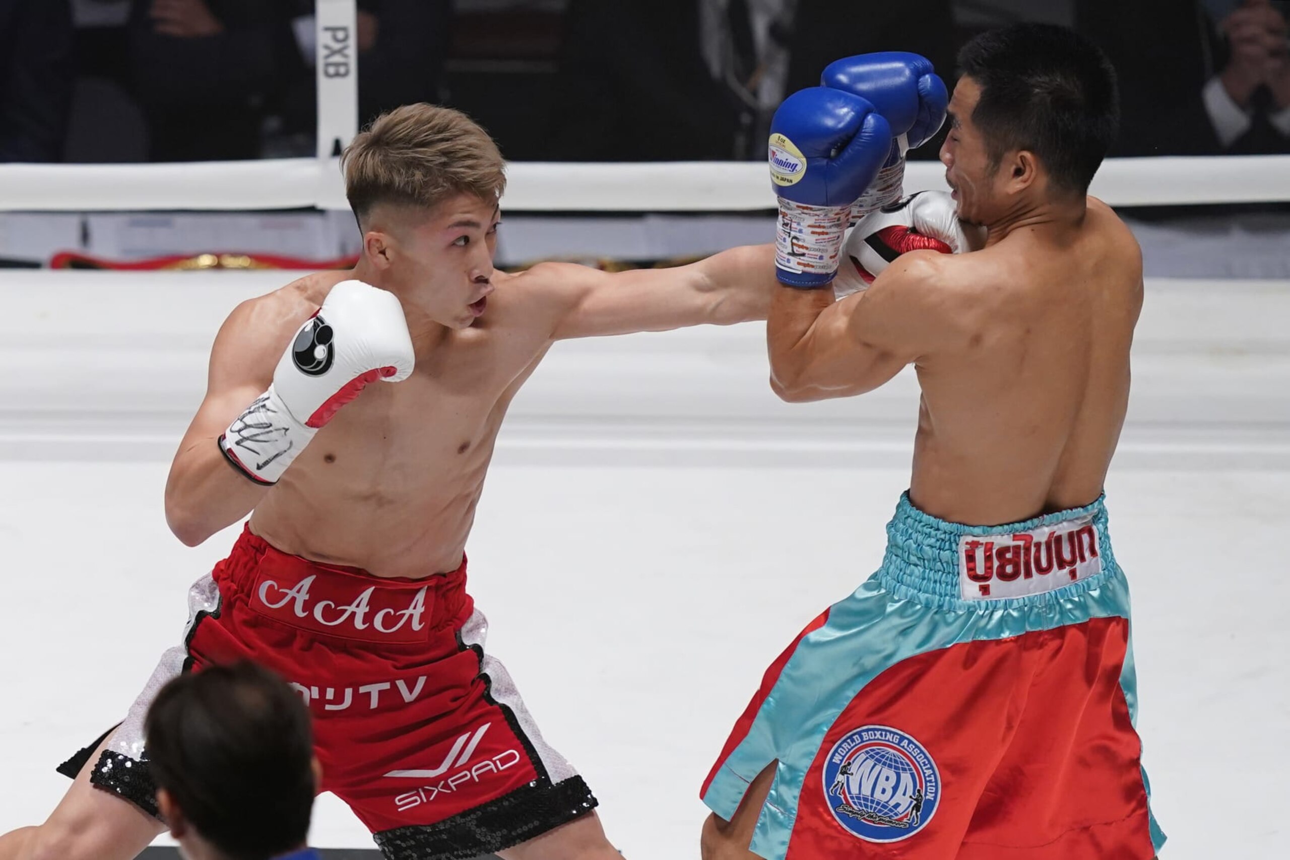 TOKYO, JAPAN - DECEMBER 14: Naoya Inoue (L) of Japan punches Aran Dipaen of Thailand during the WBA Super Bantamweight and IBO Bantamweight title bout at Ryogoku Kokugikan on December 14, 2021 in Tokyo, Japan. (Photo by Toru Hanai/Getty Images)