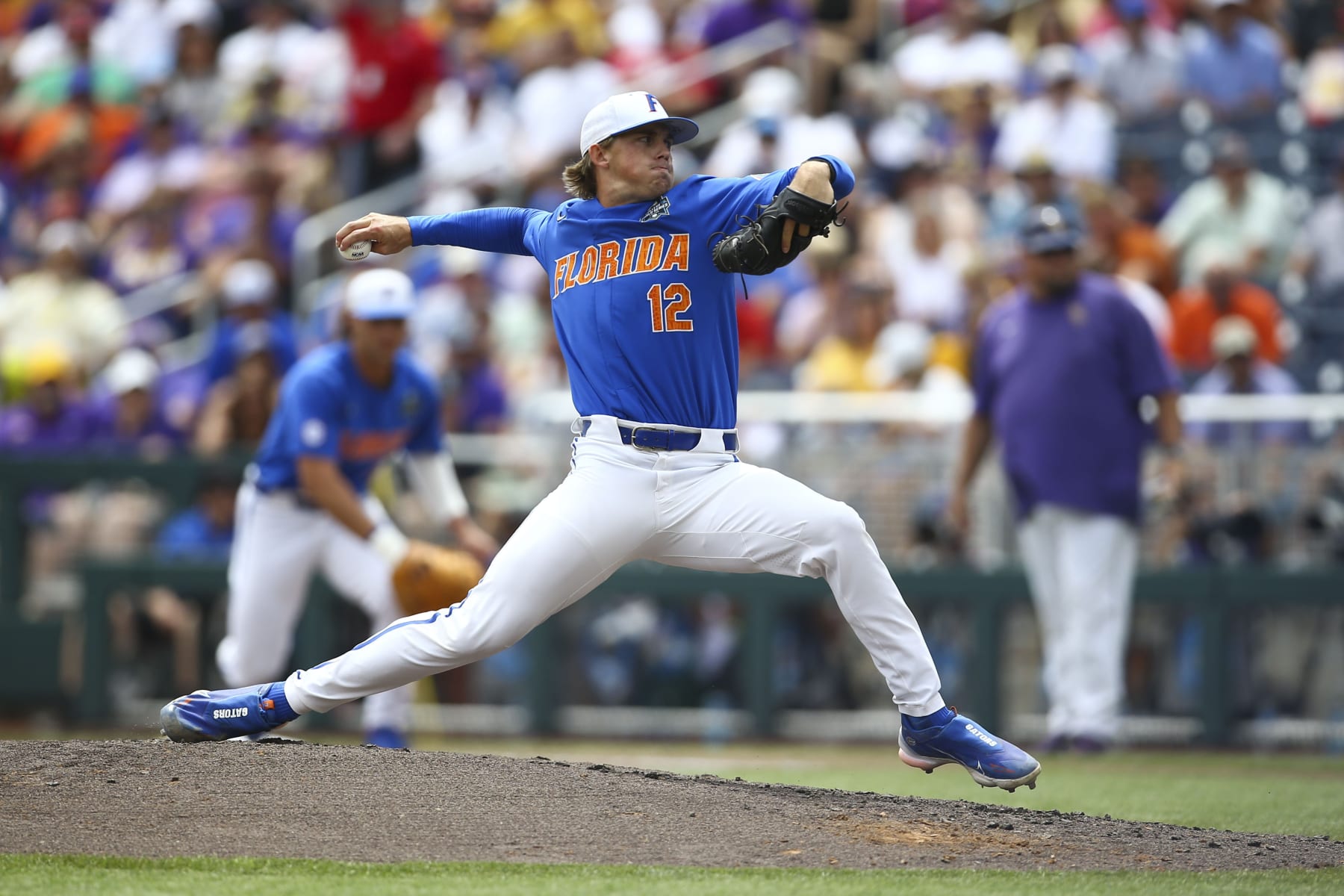 Florida pitcher Hurston Waldrep (12) throws during the inning of Game 2 of the NCAA College World Series baseball finals against LSU in Omaha, Neb., Sunday, June 25, 2023. (AP Photo/John Peterson)