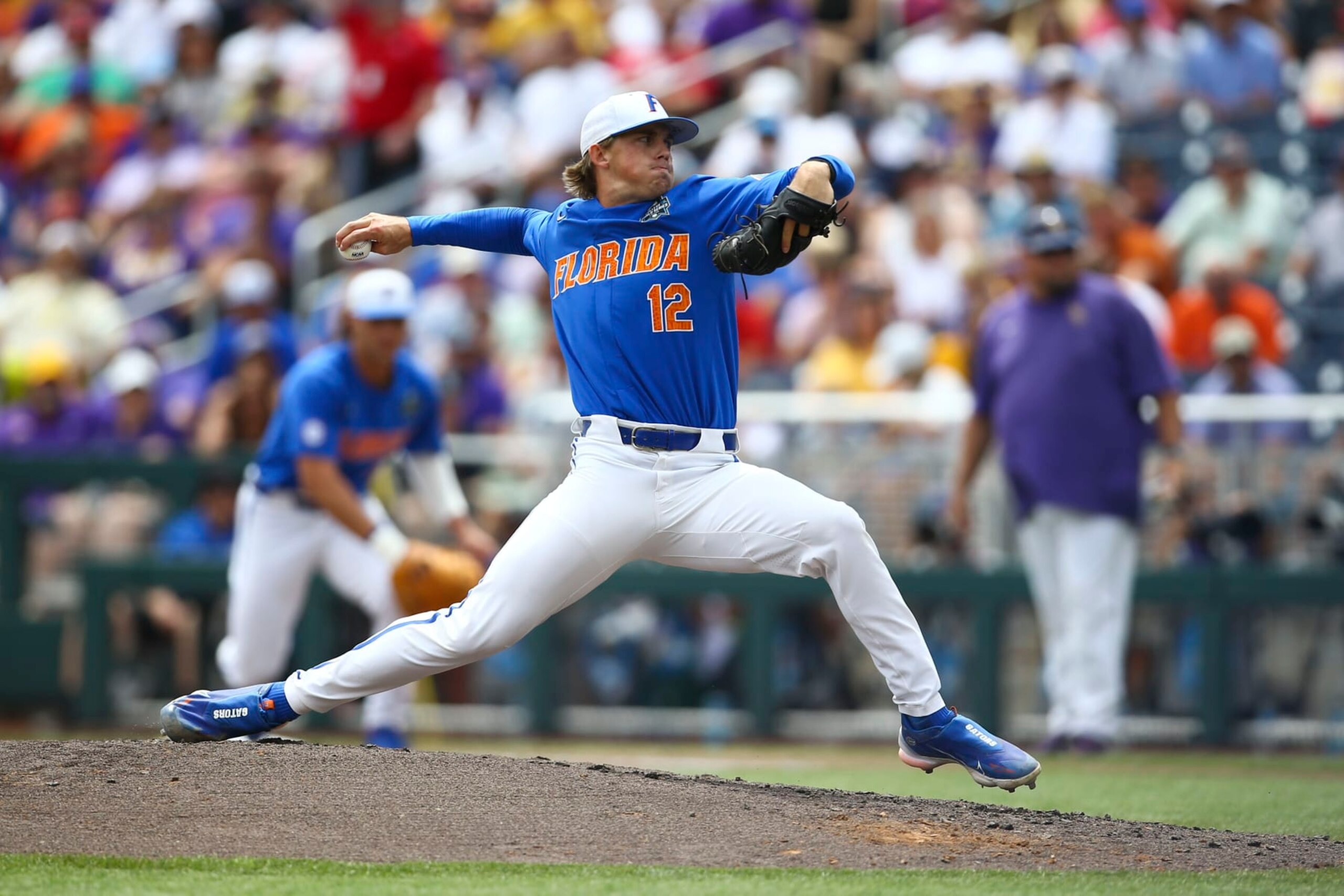 Florida pitcher Hurston Waldrep (12) throws during the inning of Game 2 of the NCAA College World Series baseball finals against LSU in Omaha, Neb., Sunday, June 25, 2023. (AP Photo/John Peterson)
